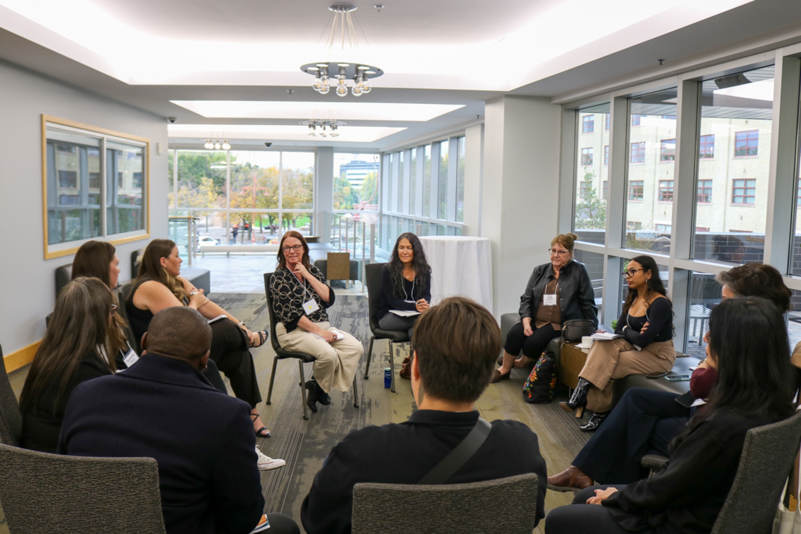 Group sitting in circles in discussion.