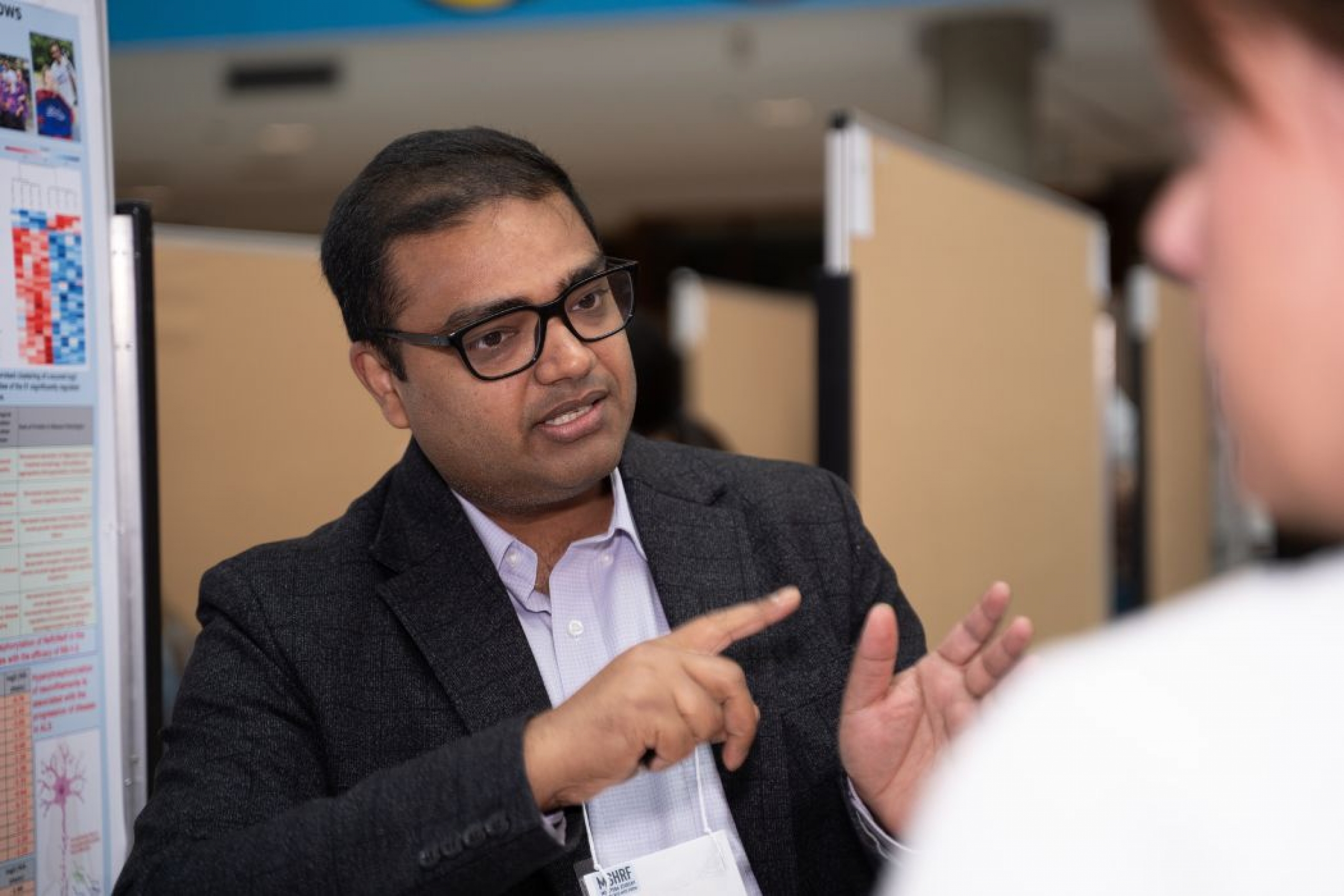 A student presenting their poster at MSHRF.