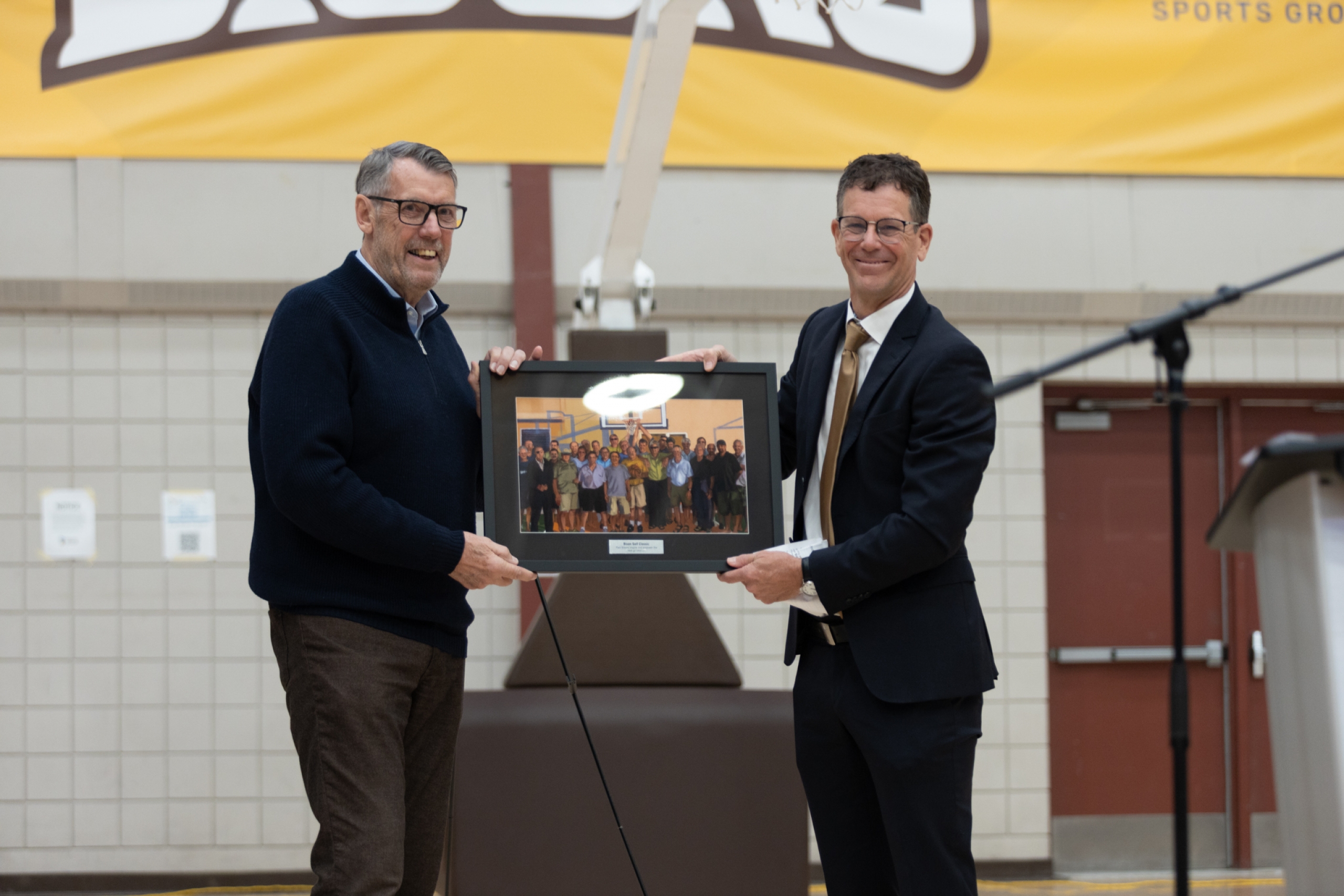 Gene Muller presenting a photo to John Loewen