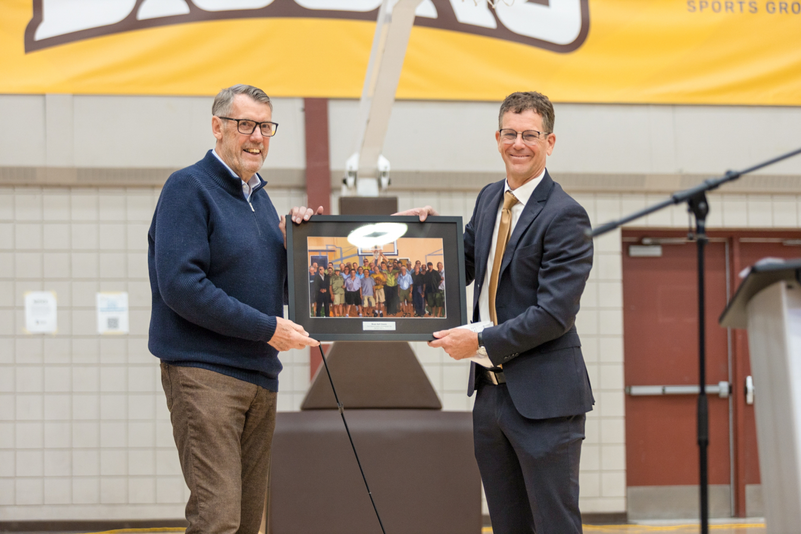 Gene Muller presenting a photo to John Loewen