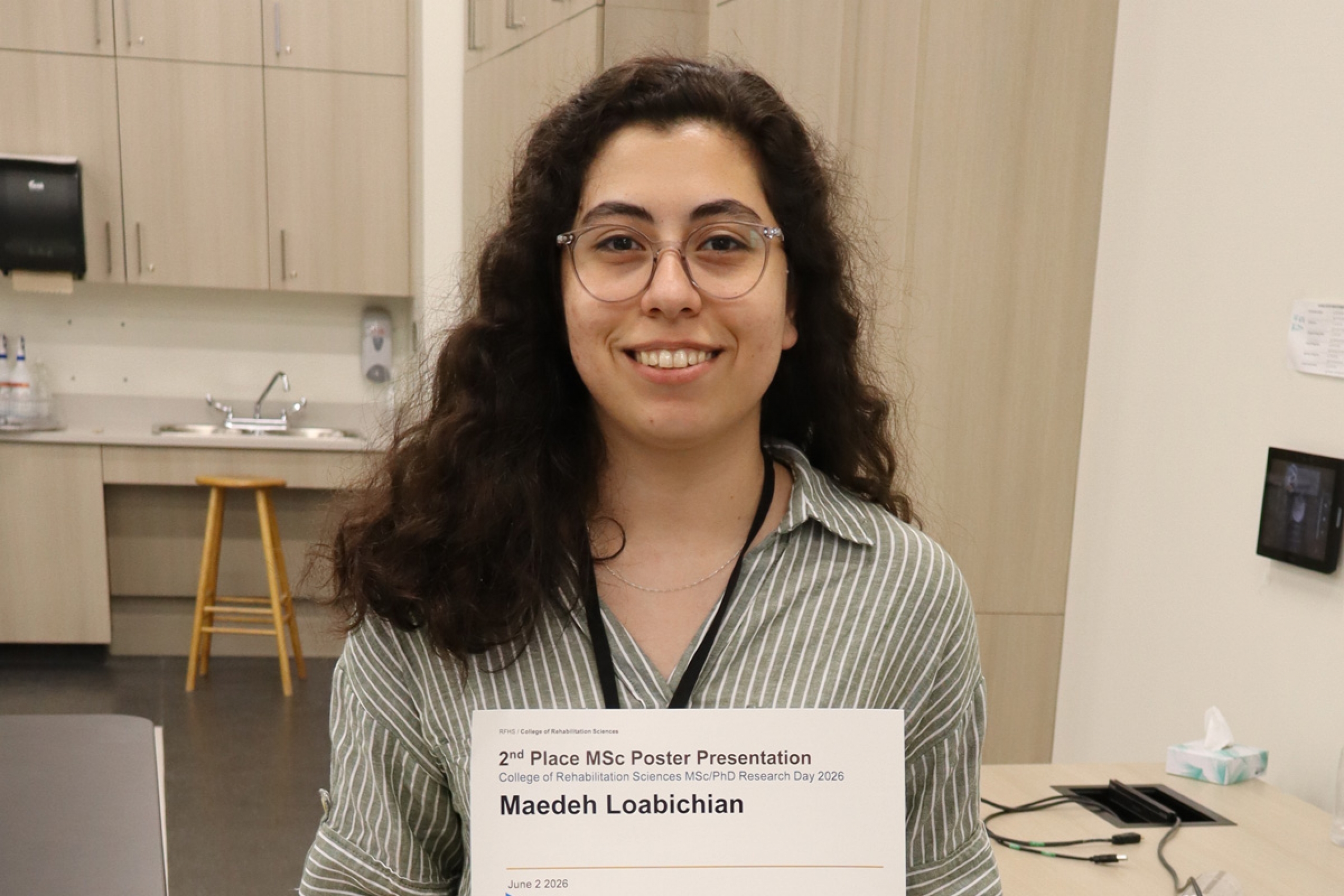 Maedeh Loabichian poses after winning an award.