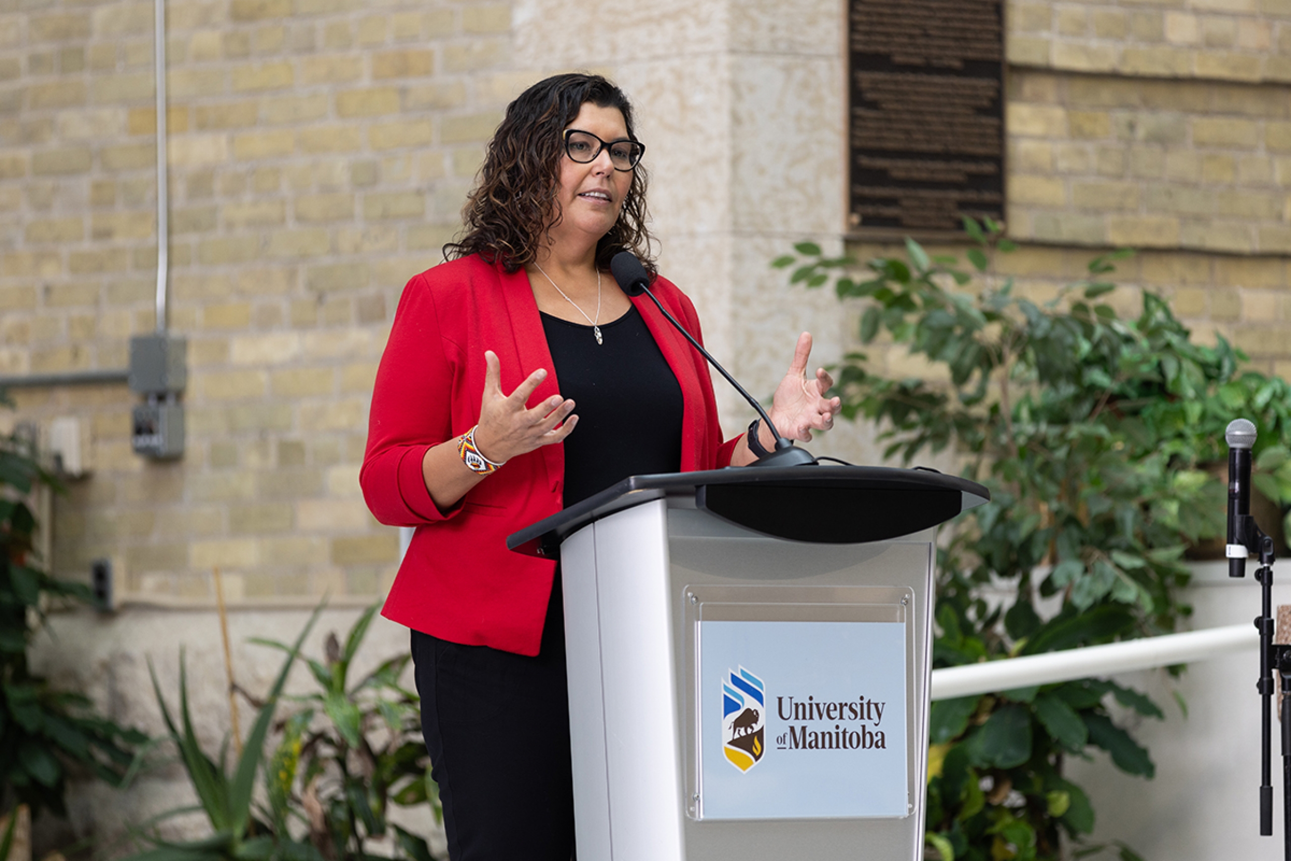 Marcia Anderson speaks at a podium.