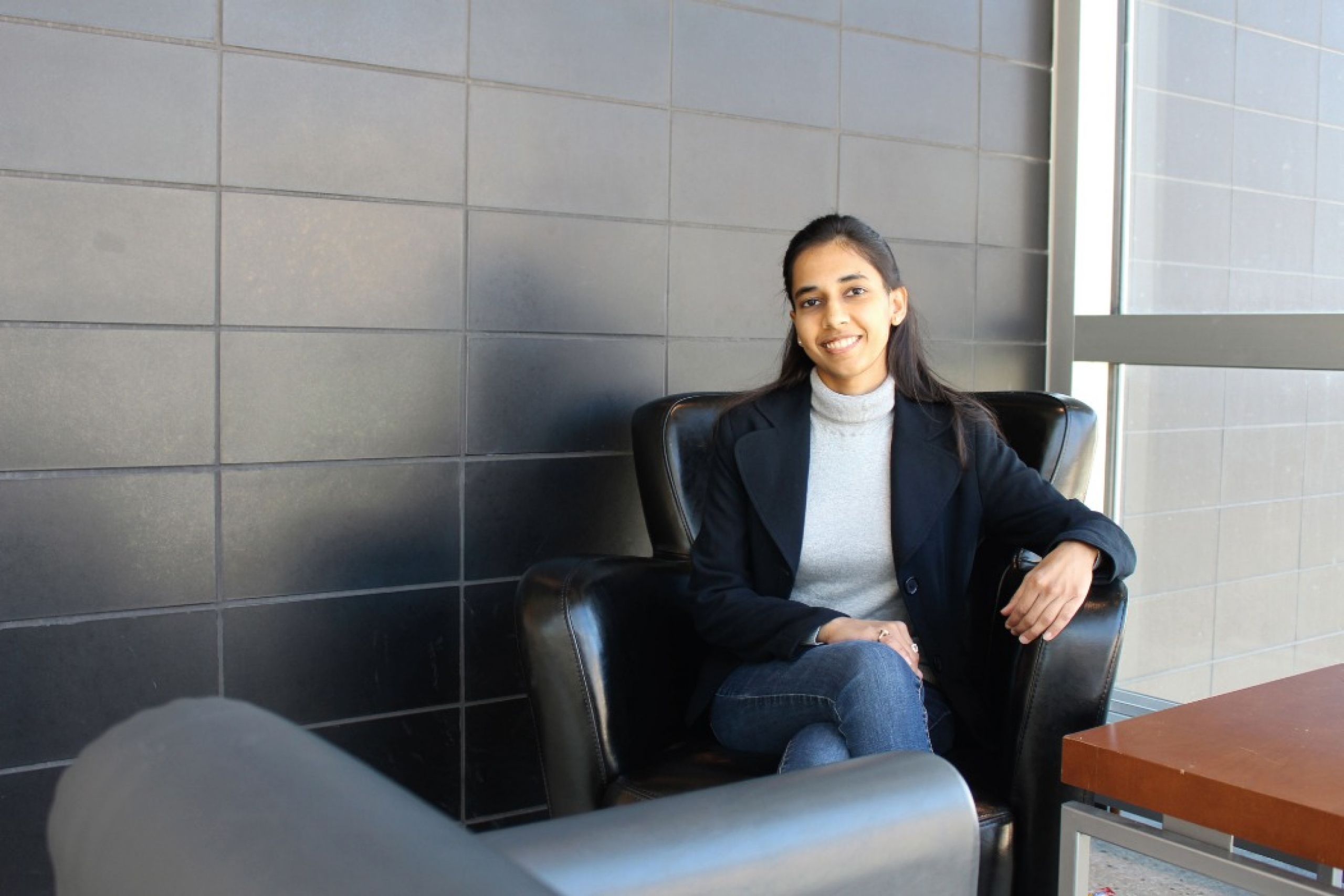 Dr. Shweta Mital sits in a chair. 
