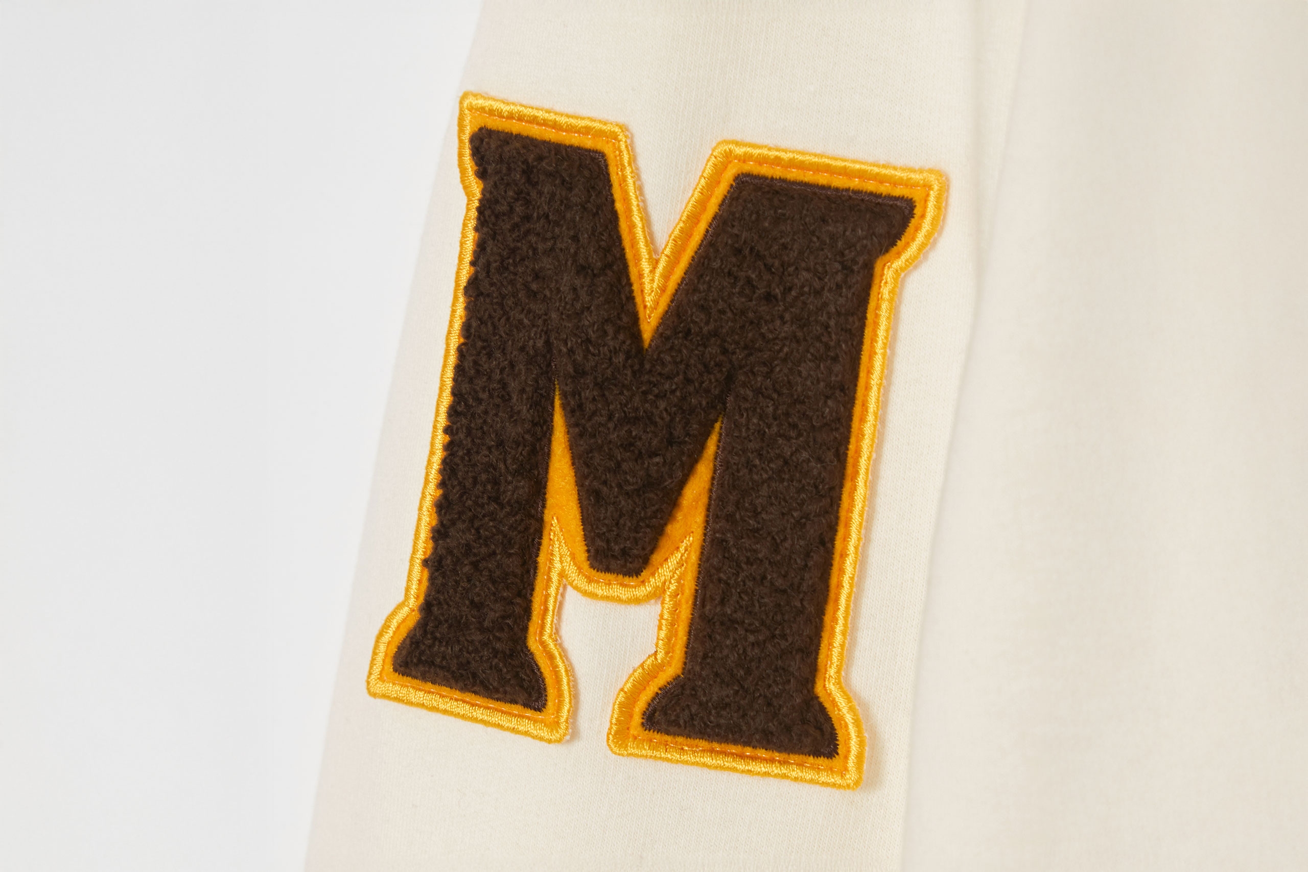 M patch in felt