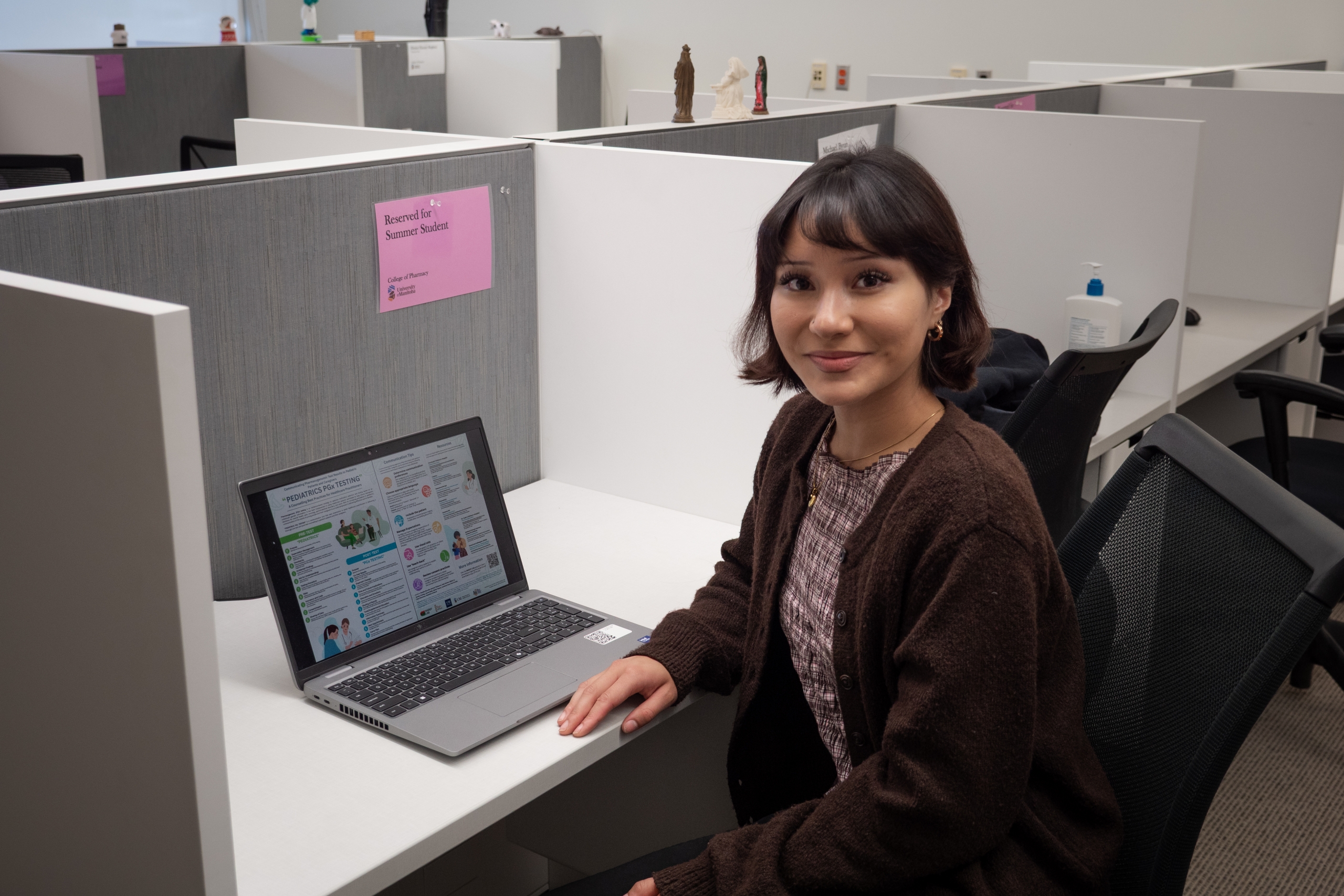 A person sitting in front of a laptop.