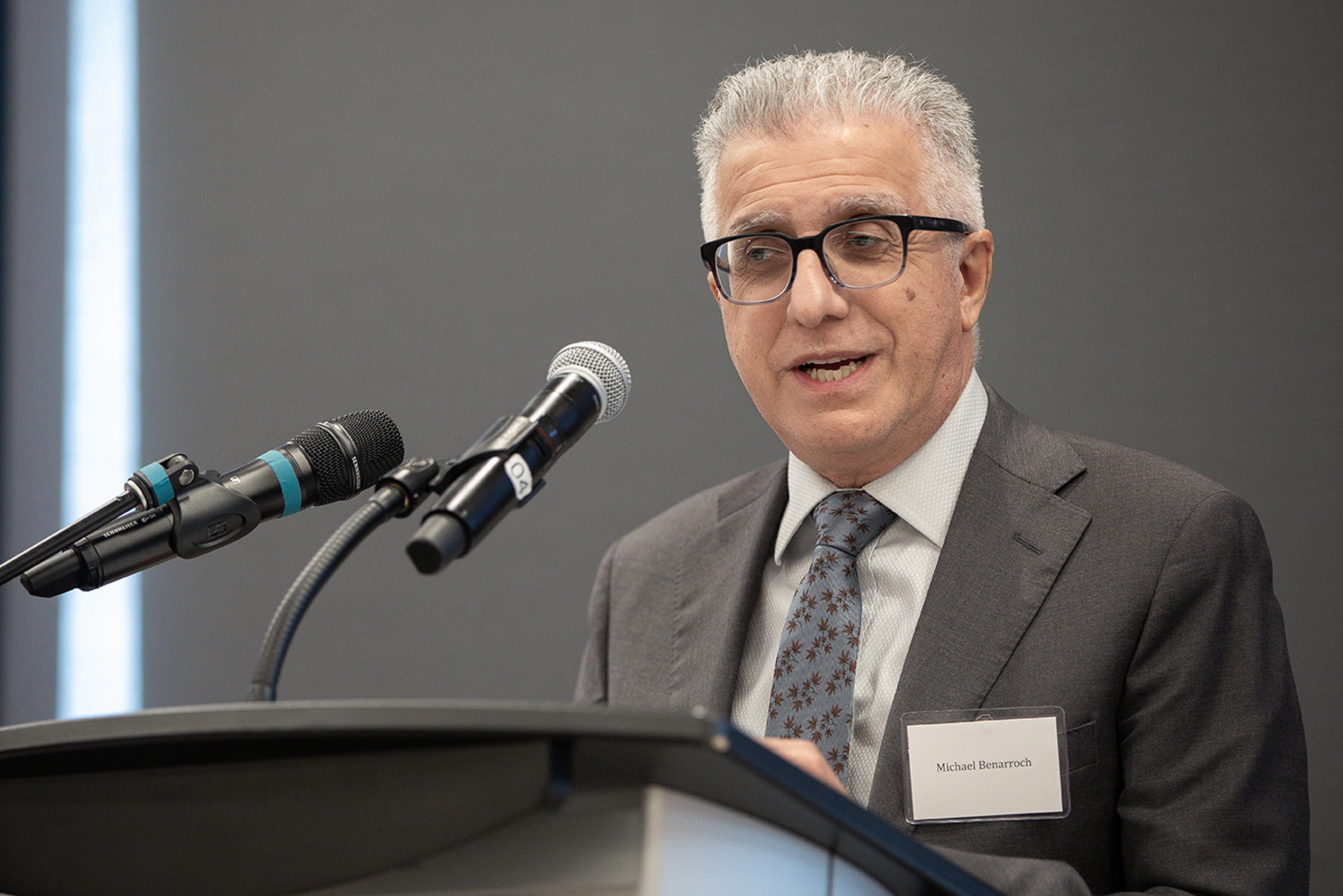 Michael Benarroch at podium