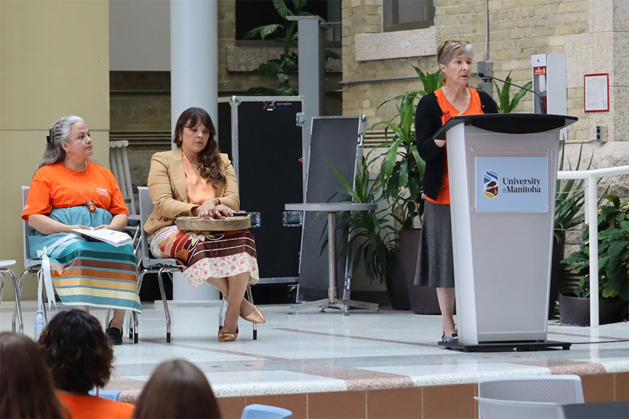 Dr. Josée Lavoie at podium speaking.