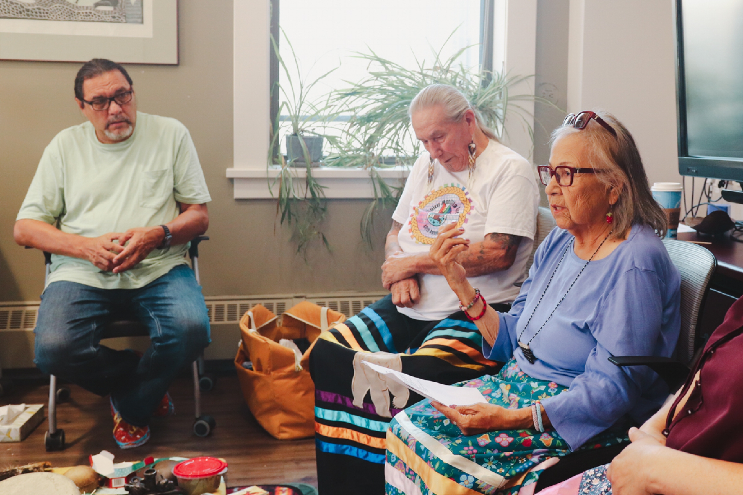 Three Elders during an Indigenous ceremony.