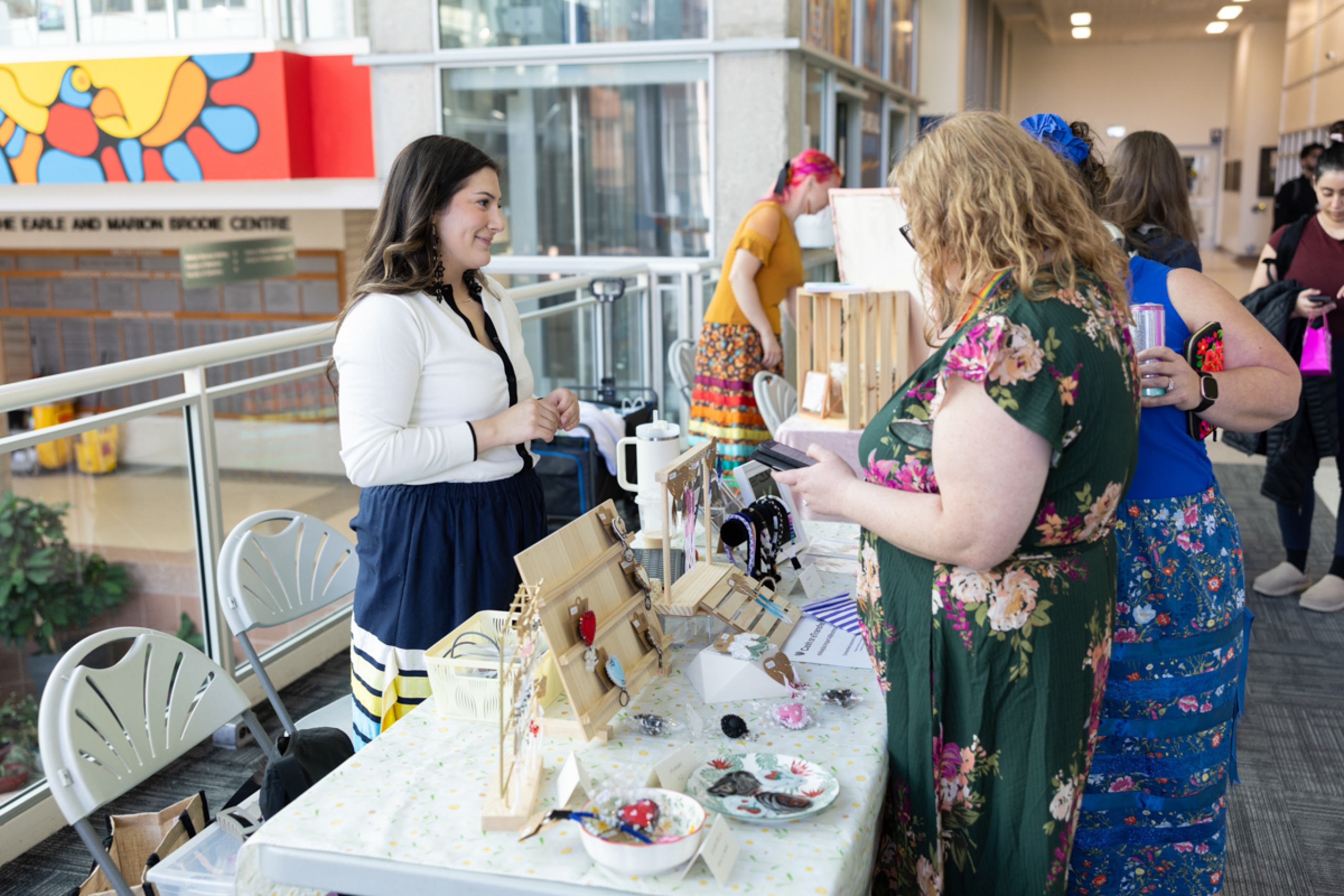 A vendor chats with customers.