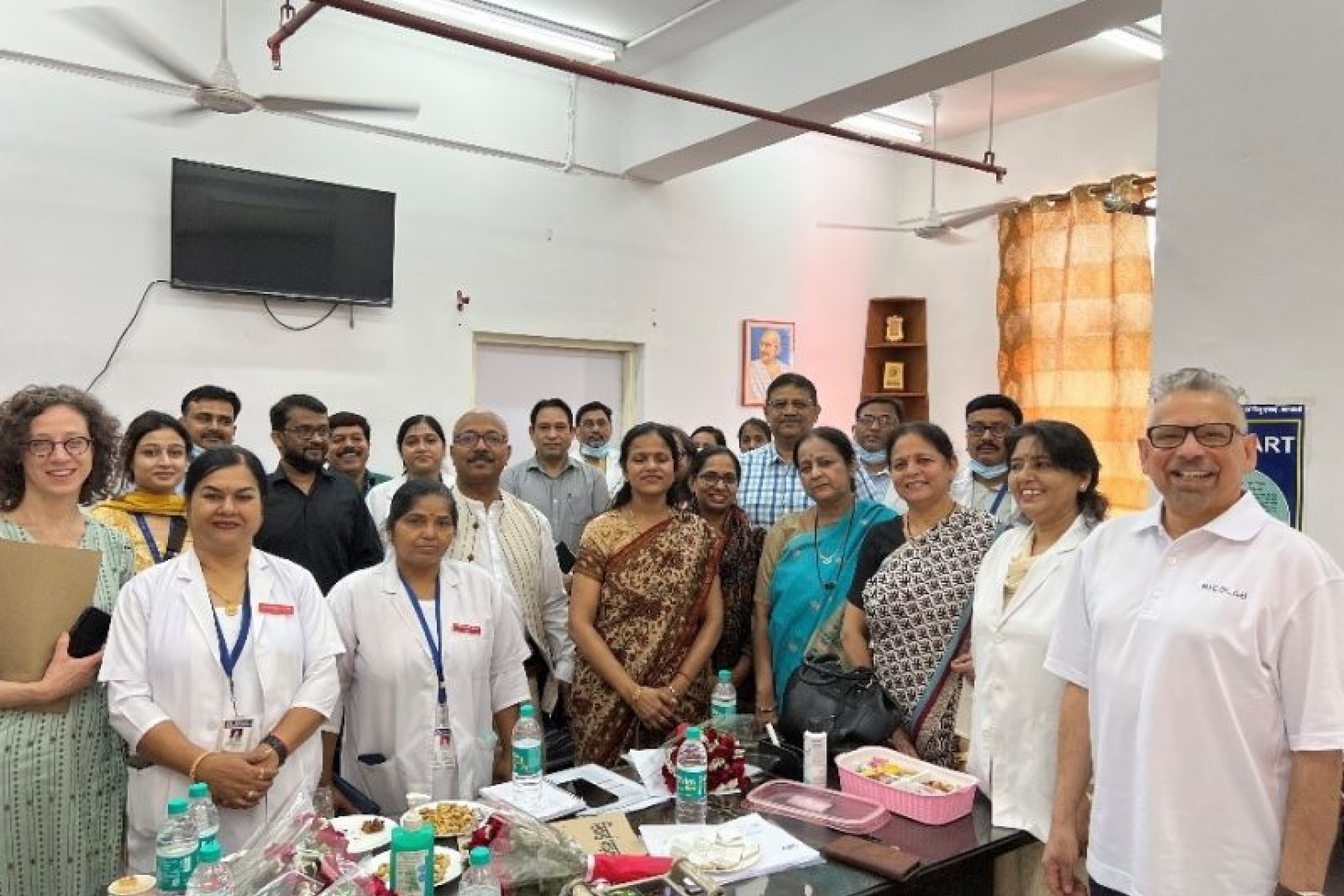 Dr. Becker and Dr. Pinto pictured with healthcare facility staff.