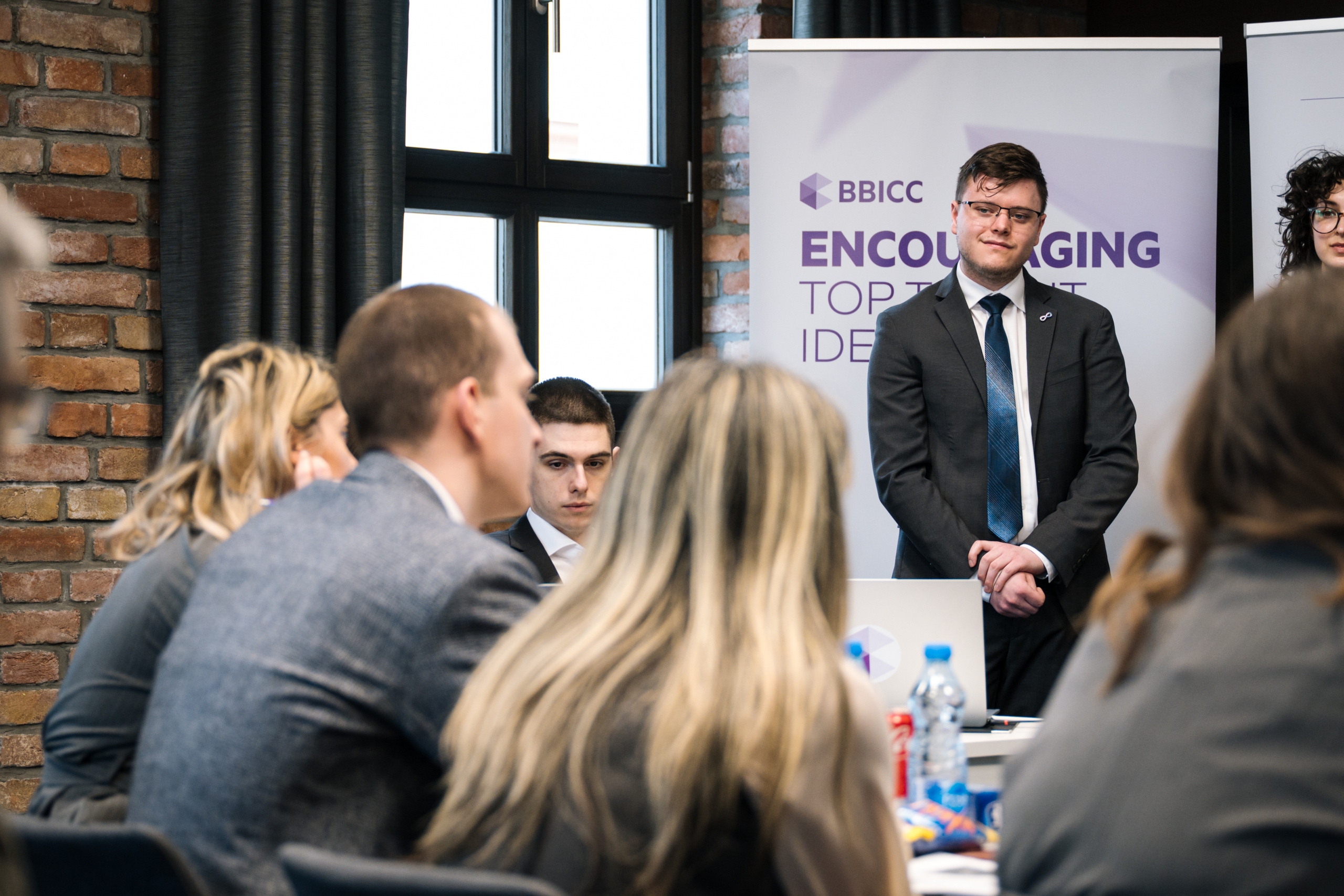 Kaiden Kalcsics presents at a Serbia case competition