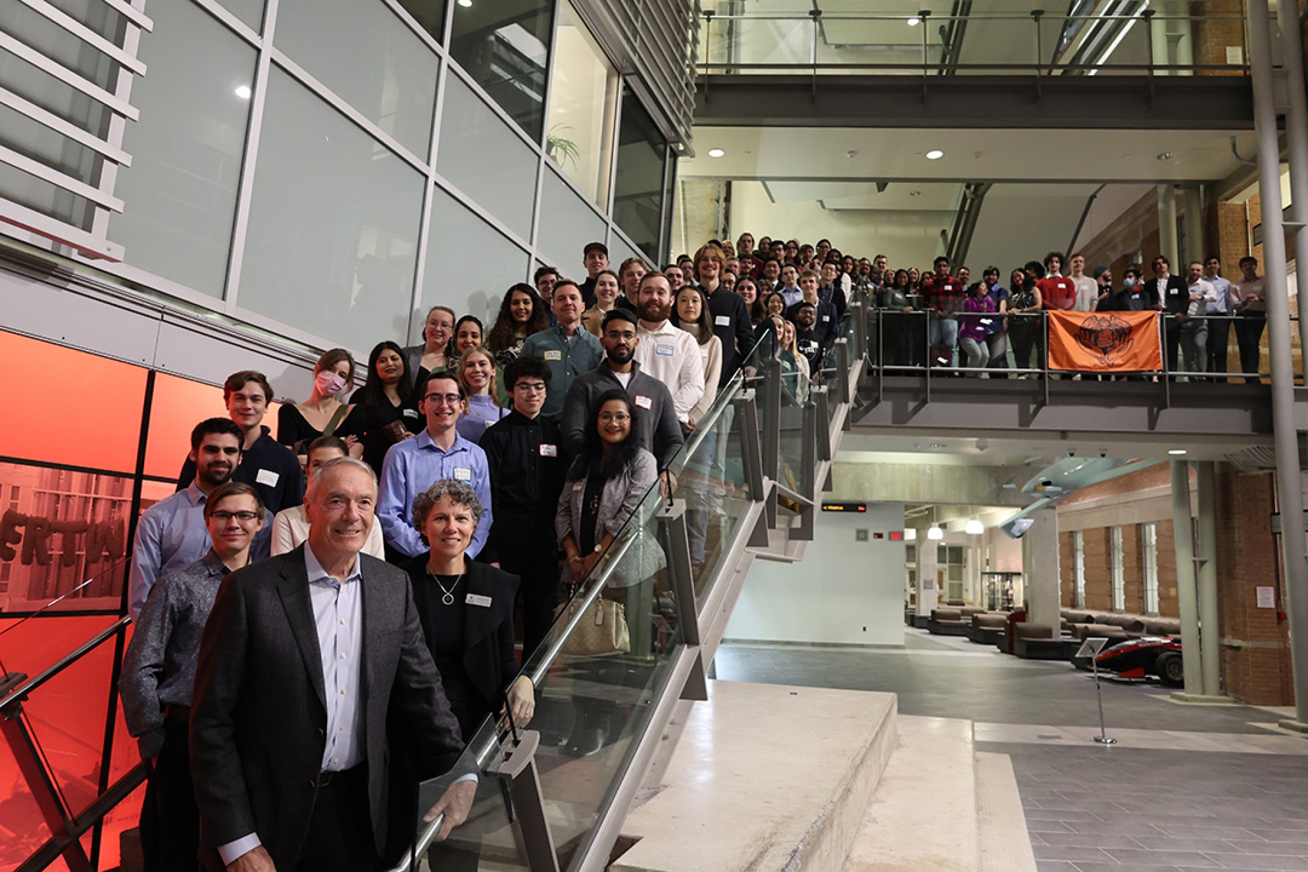 A large group of people posing on staircase inside the engineering building