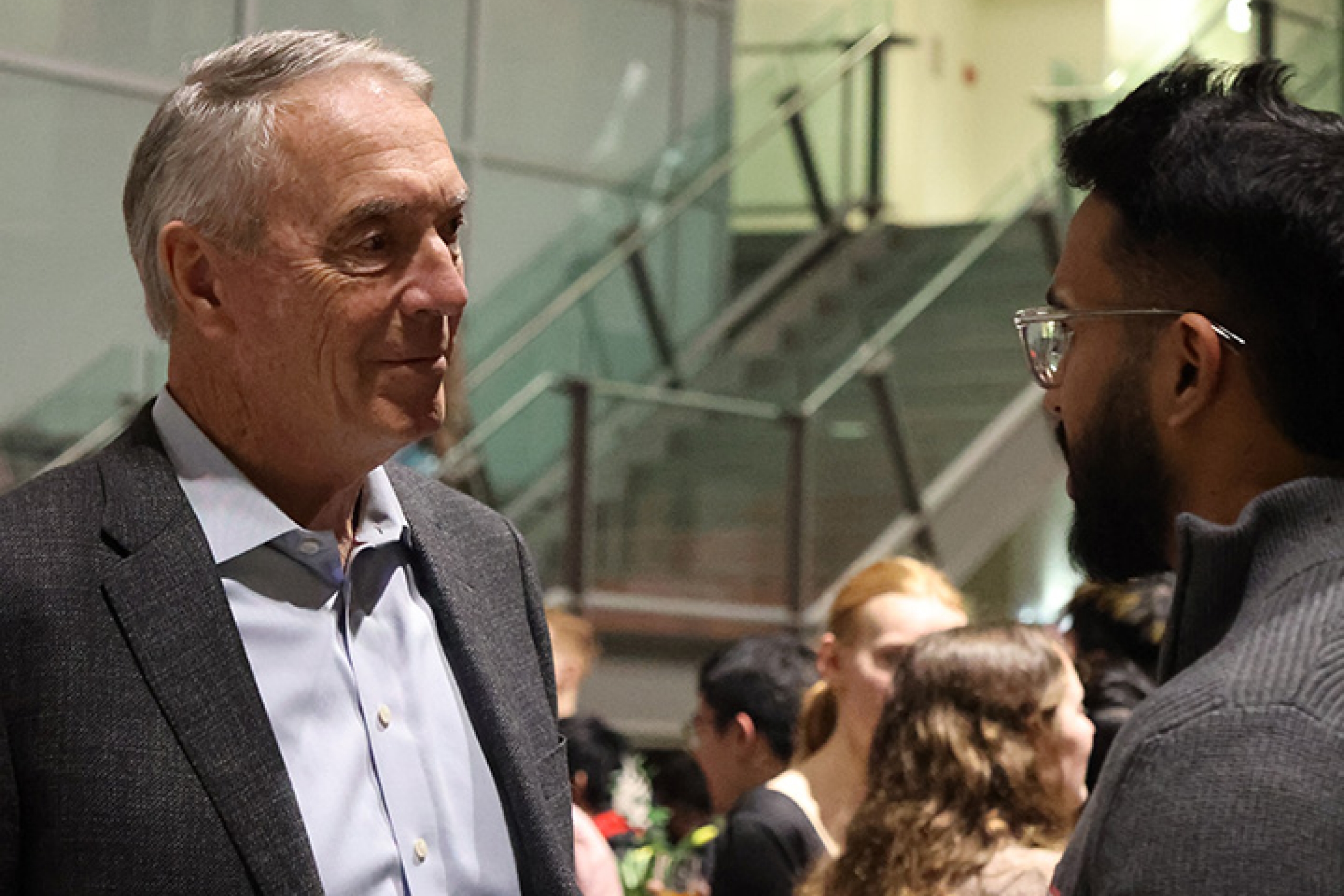 two people in conversation at a reception