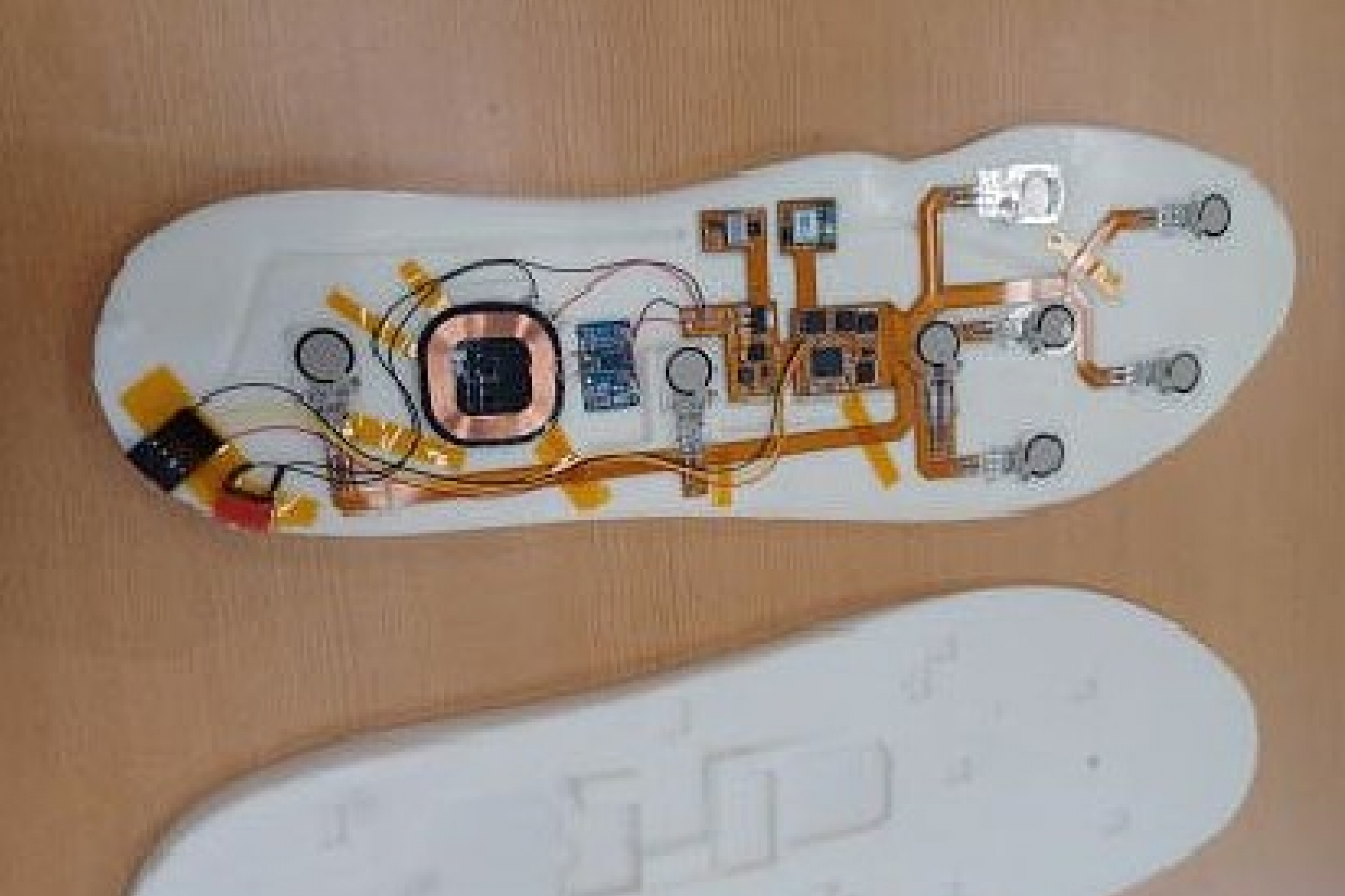 A prototype of a Smart Shoe Sole (left) and the mold for the shoe sole (right), as developed by researchers at Red River College.