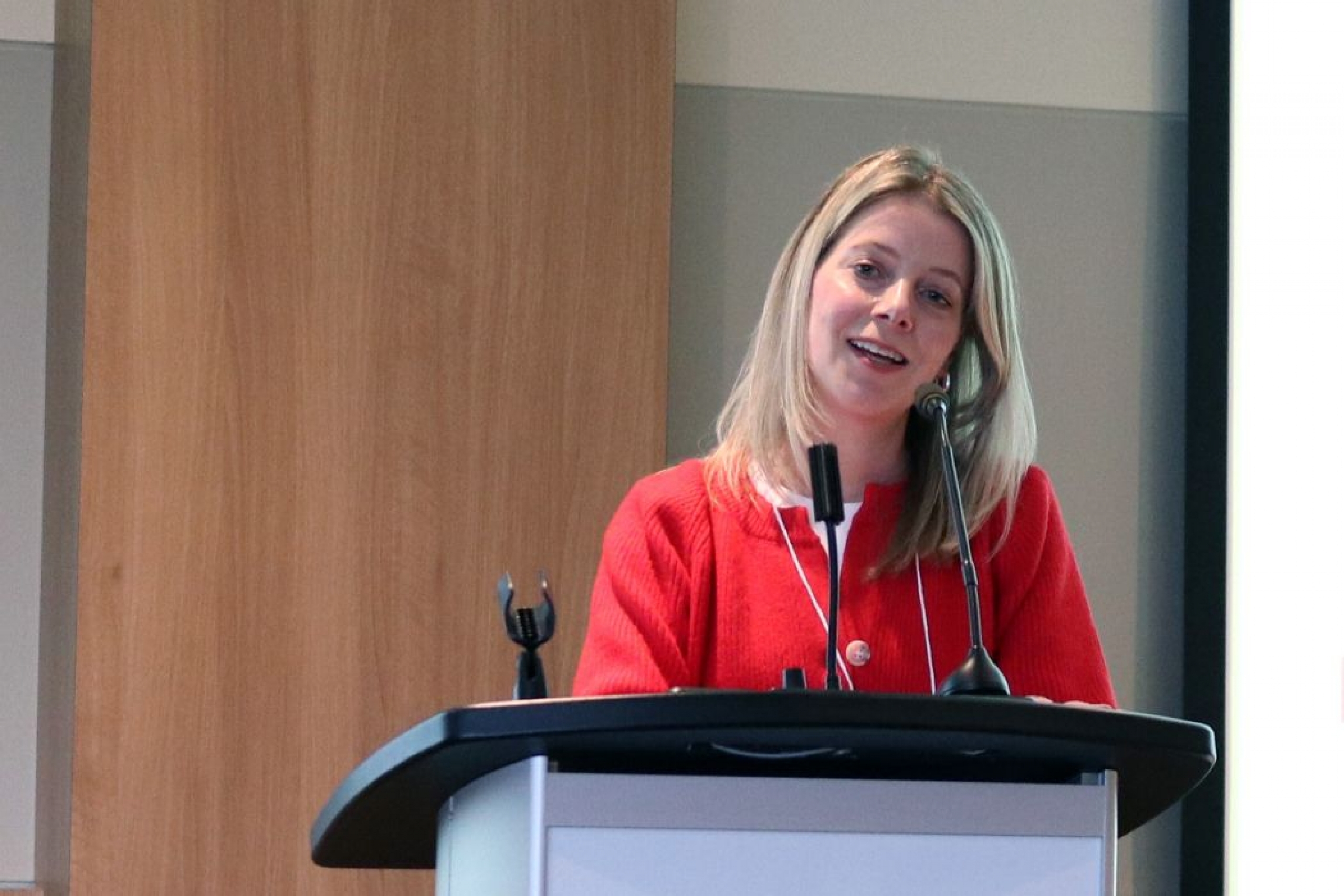 Dr. Jennifer Rabin speaks at a lectern.
