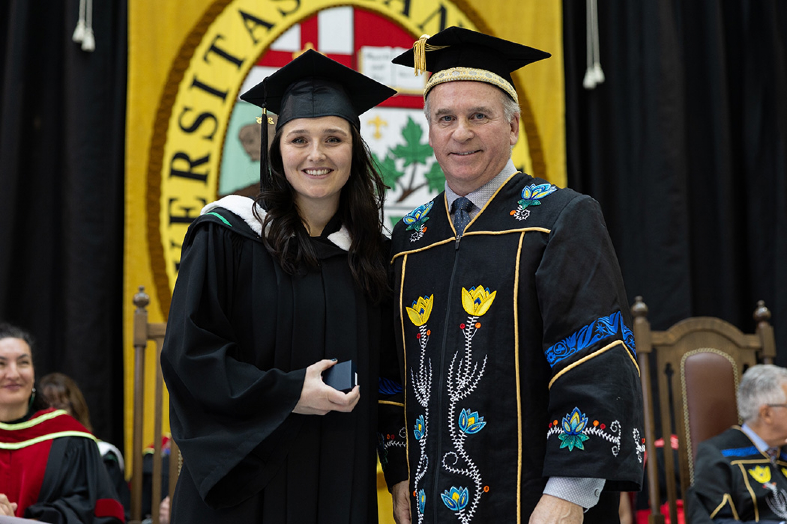 Rachel Donnelly poses alongside Chancellor David Angus at convocation.