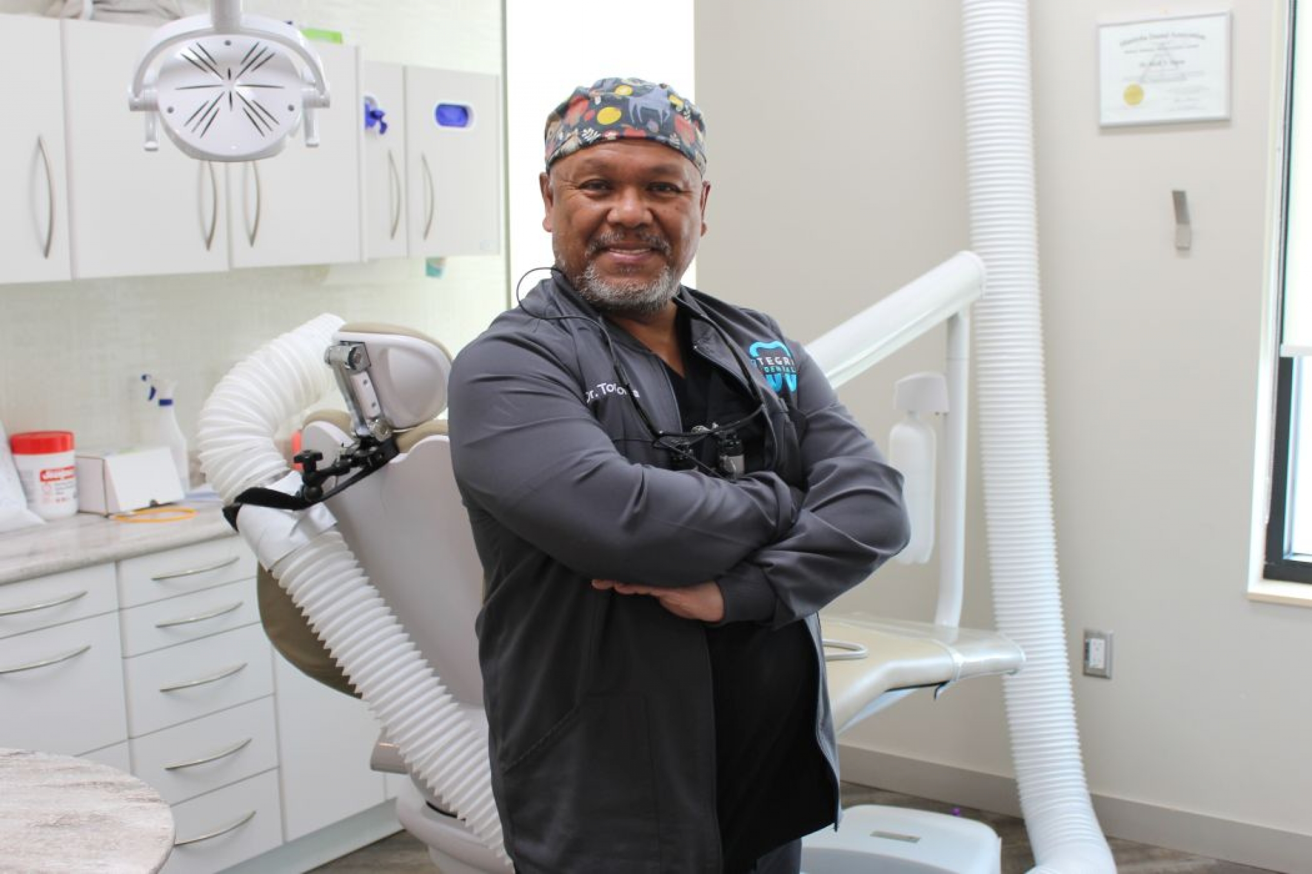 Portrait of Dr. Tom Colina in a dental operatory. 
