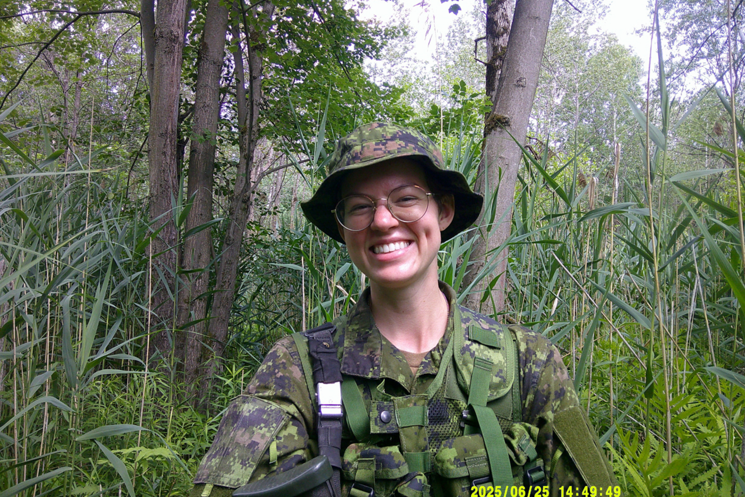 A military person in the woods.