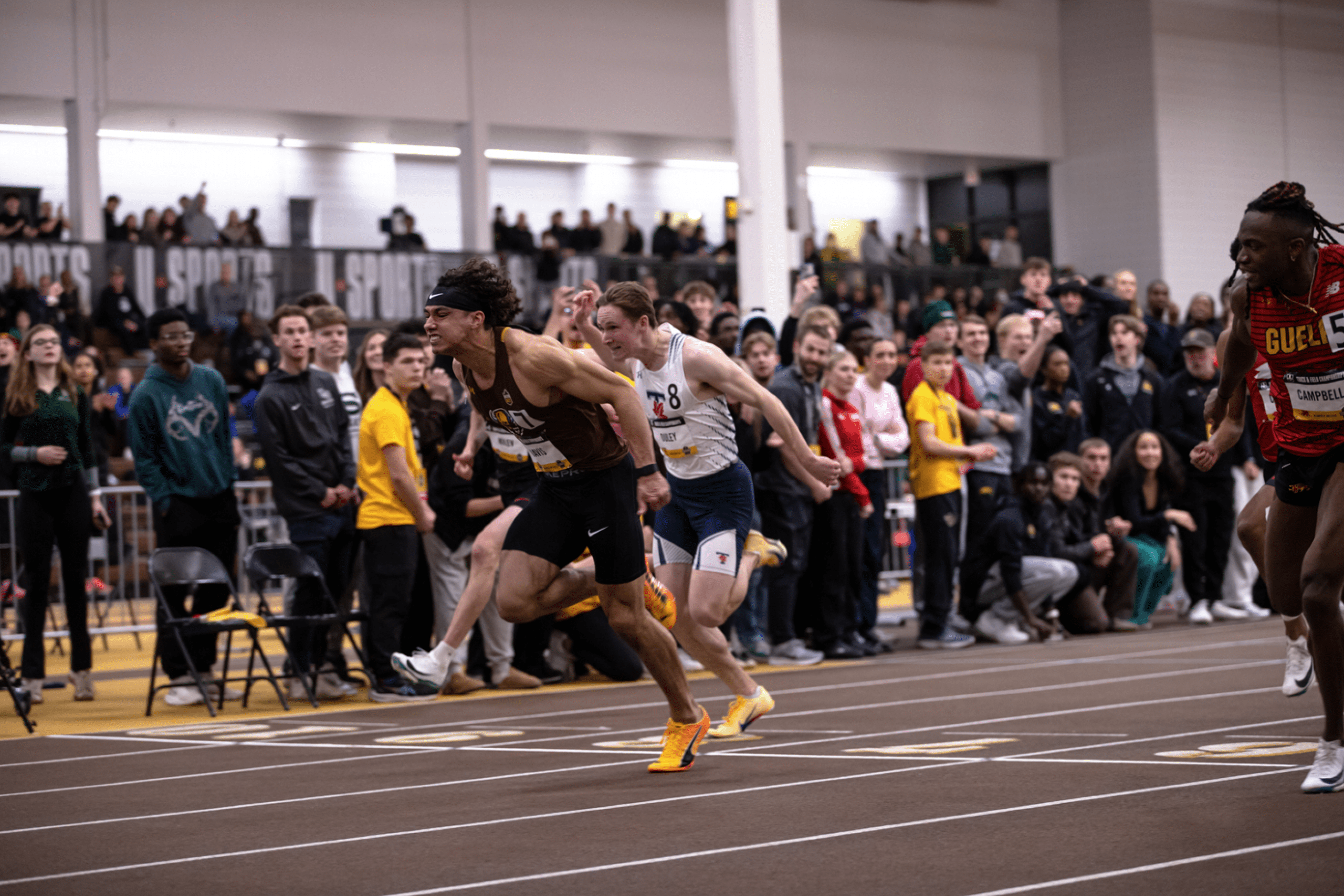 Tyrell Davis crosses the finish line first in the team relay