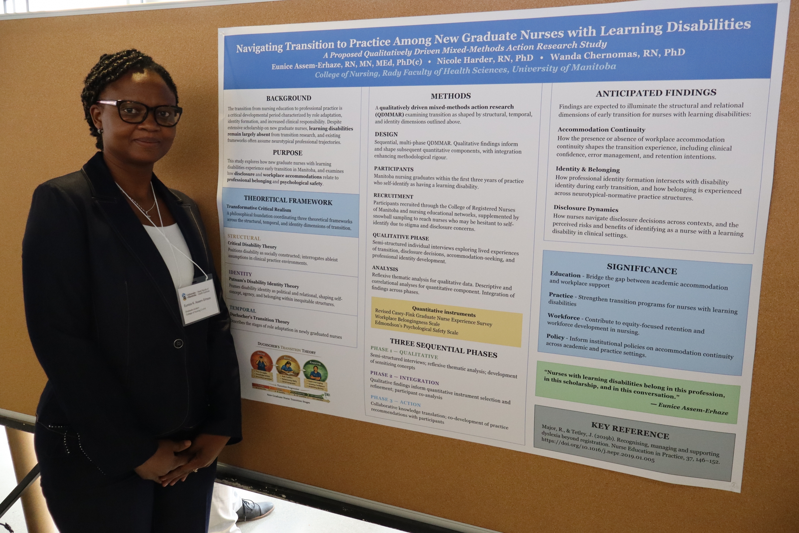 Eunice Assem-Erhaze stands next to her poster. 