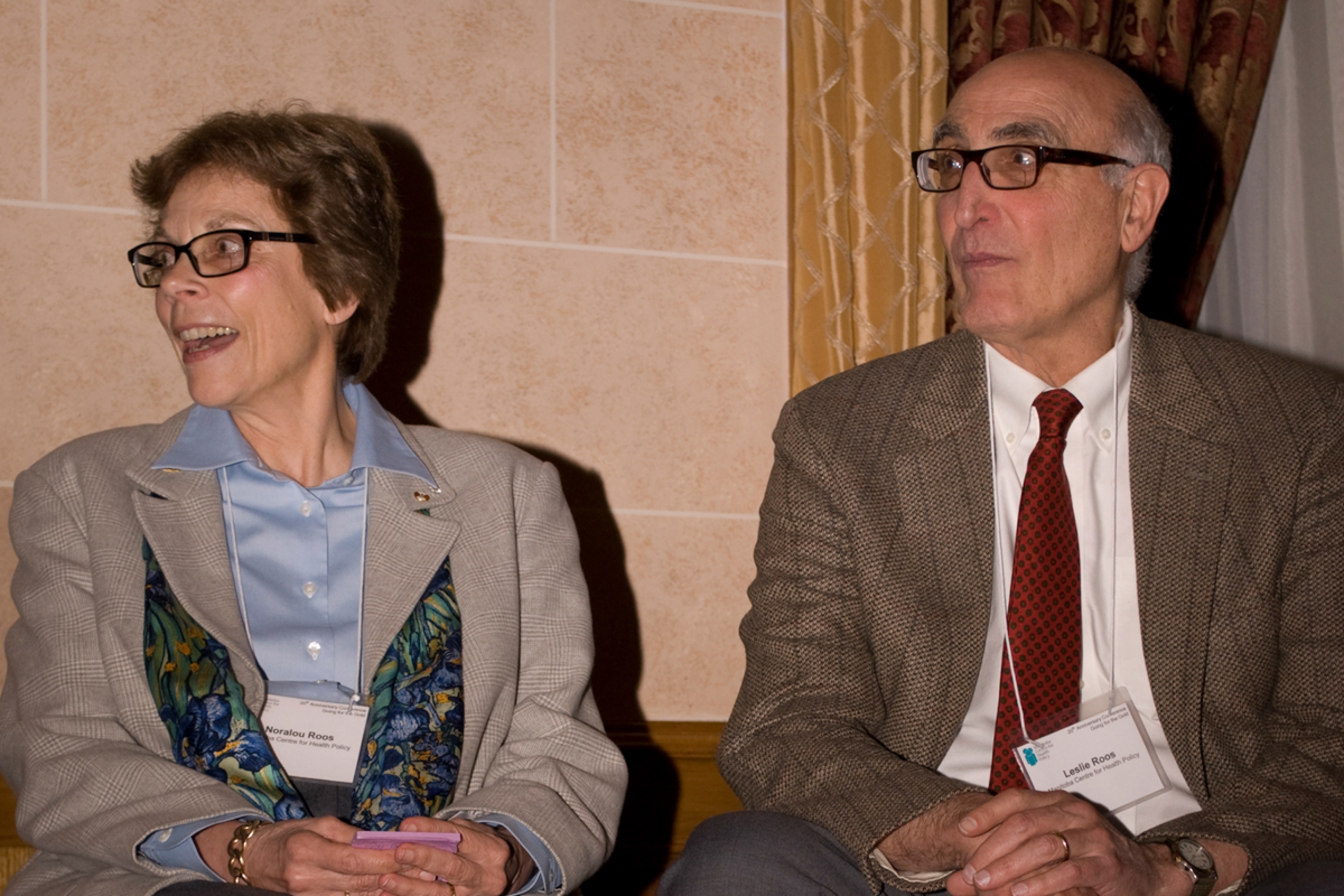 Two people sitting side by side looking to their right.