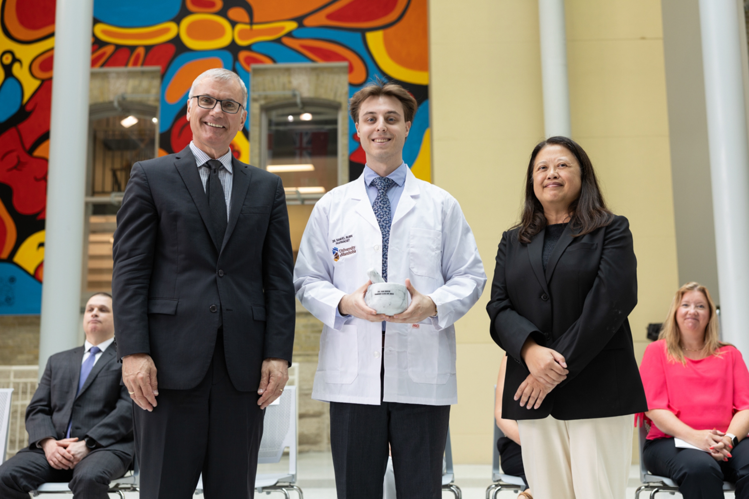 Student with two faculty members.