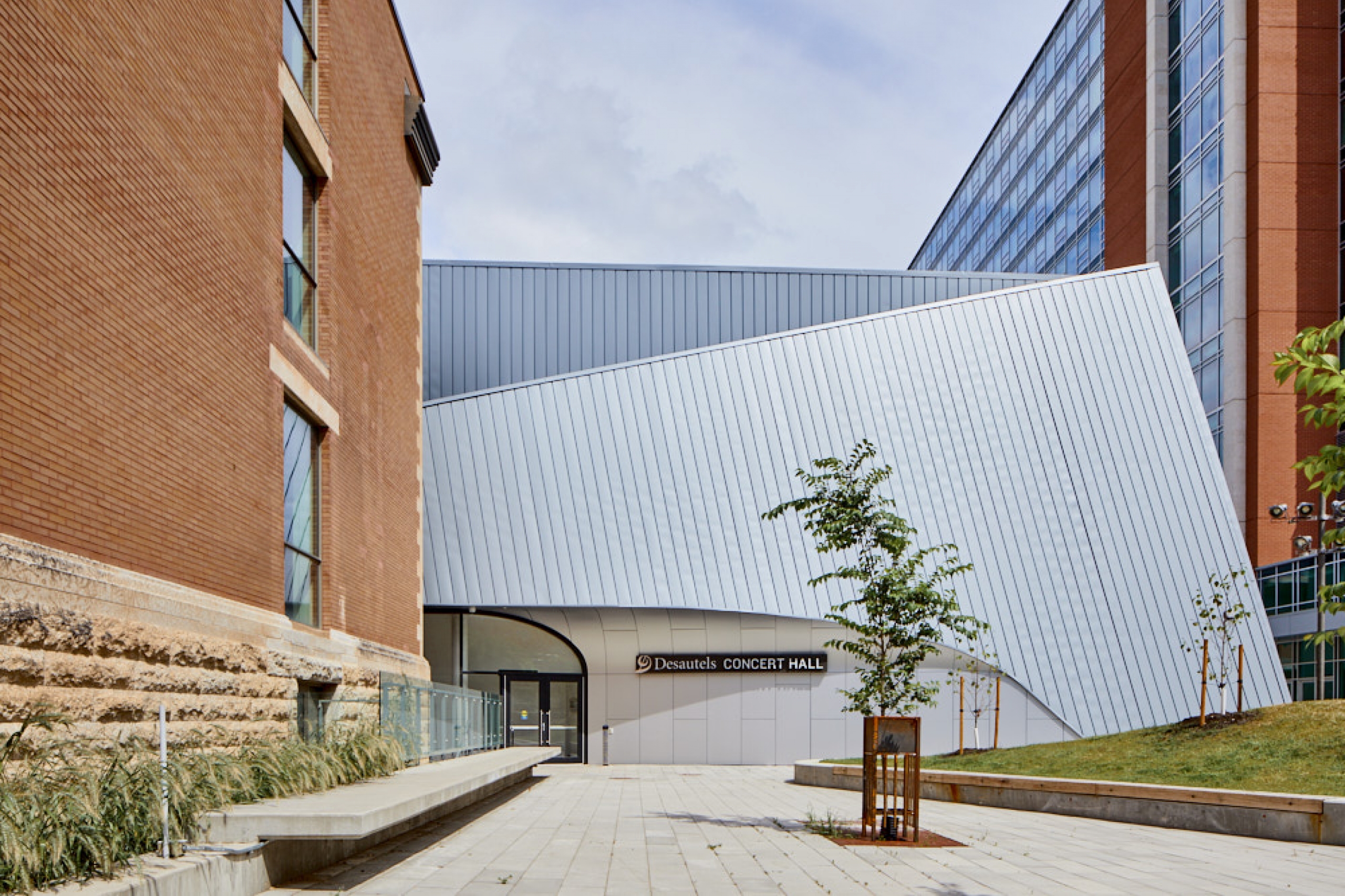 The main entrance and angular exterior of the Desautels Concert Hall.