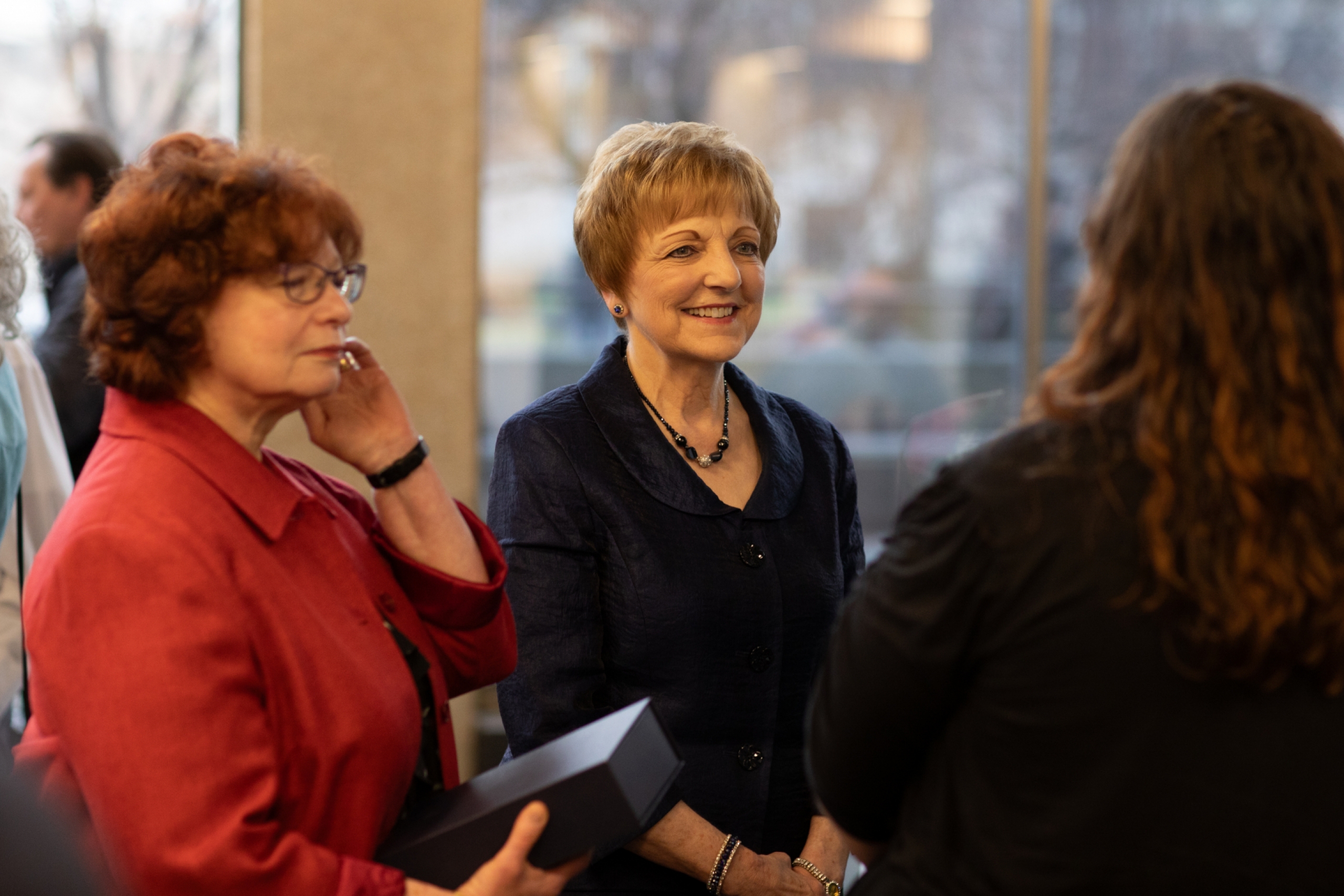 Two women talking at the STRR event. 