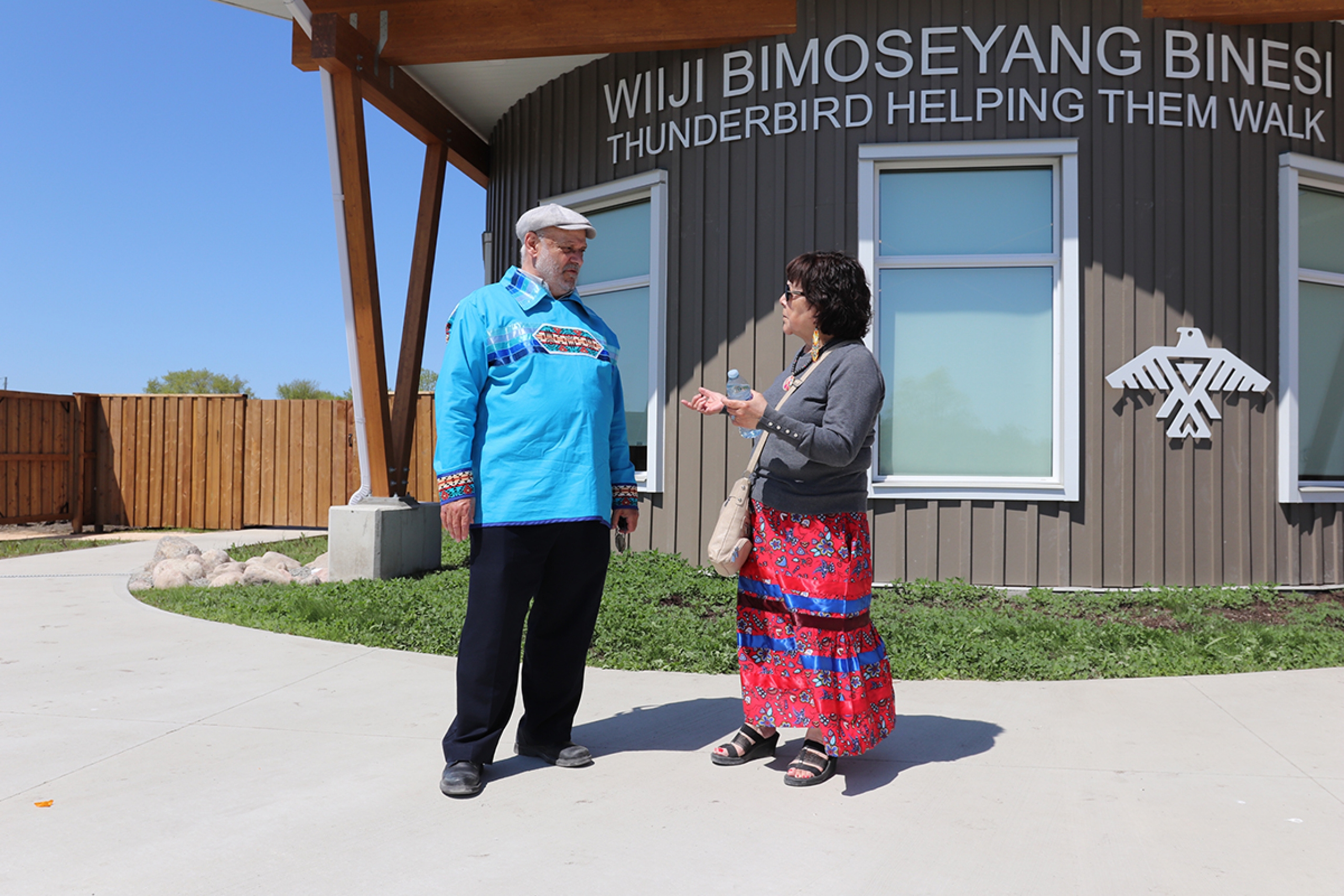 College of Rehabilitation Sciences dean Dr. Reg Urbanowski and Audrey Henderson of Sagkeeng First Nation outside the community's new supported living complex.