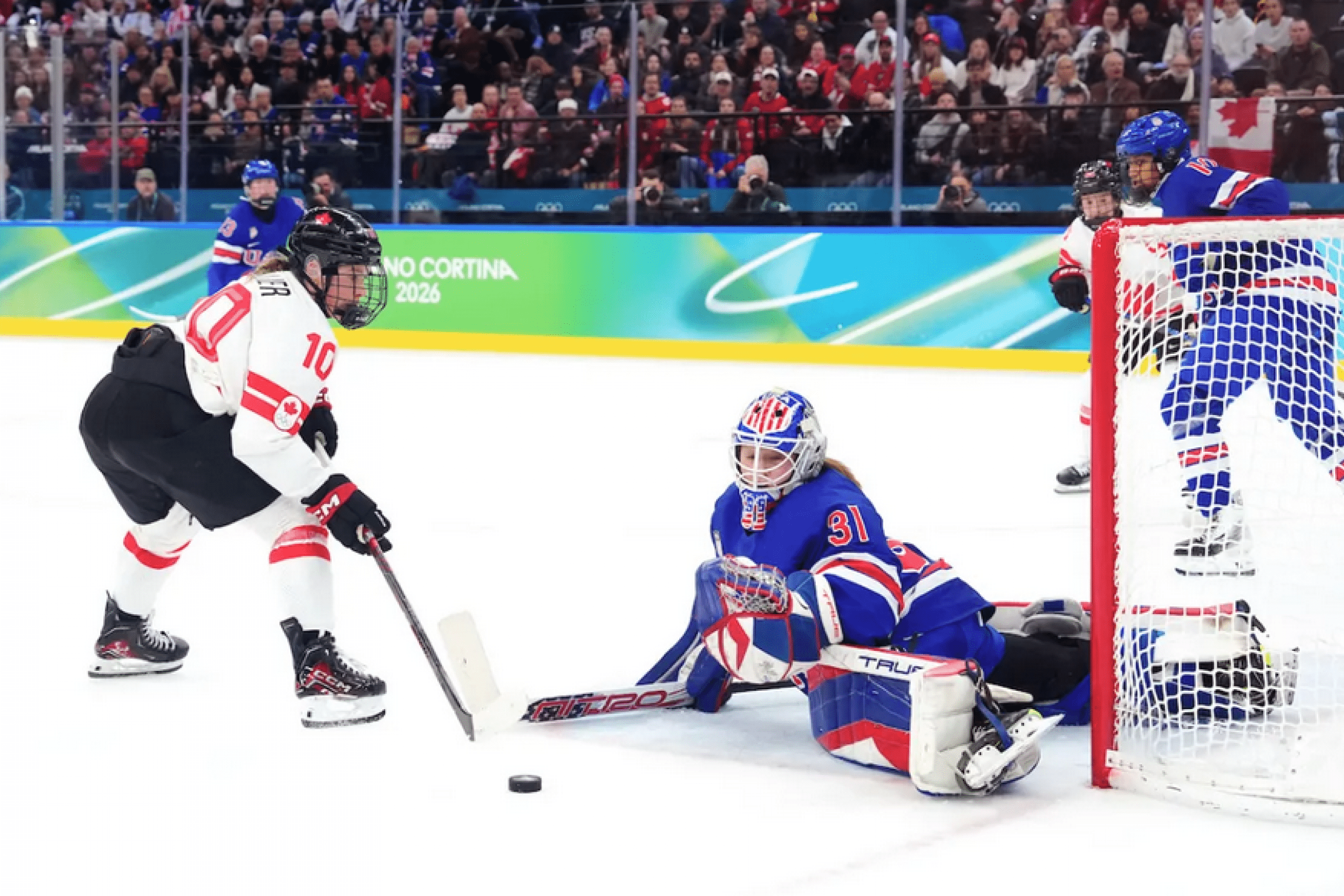 A Team Canada player tries to score on Team USA’s goaltender during the gold medal game in Women’s Ice Hockey at the Milano Cortina 2026 Olympic Winter Games.