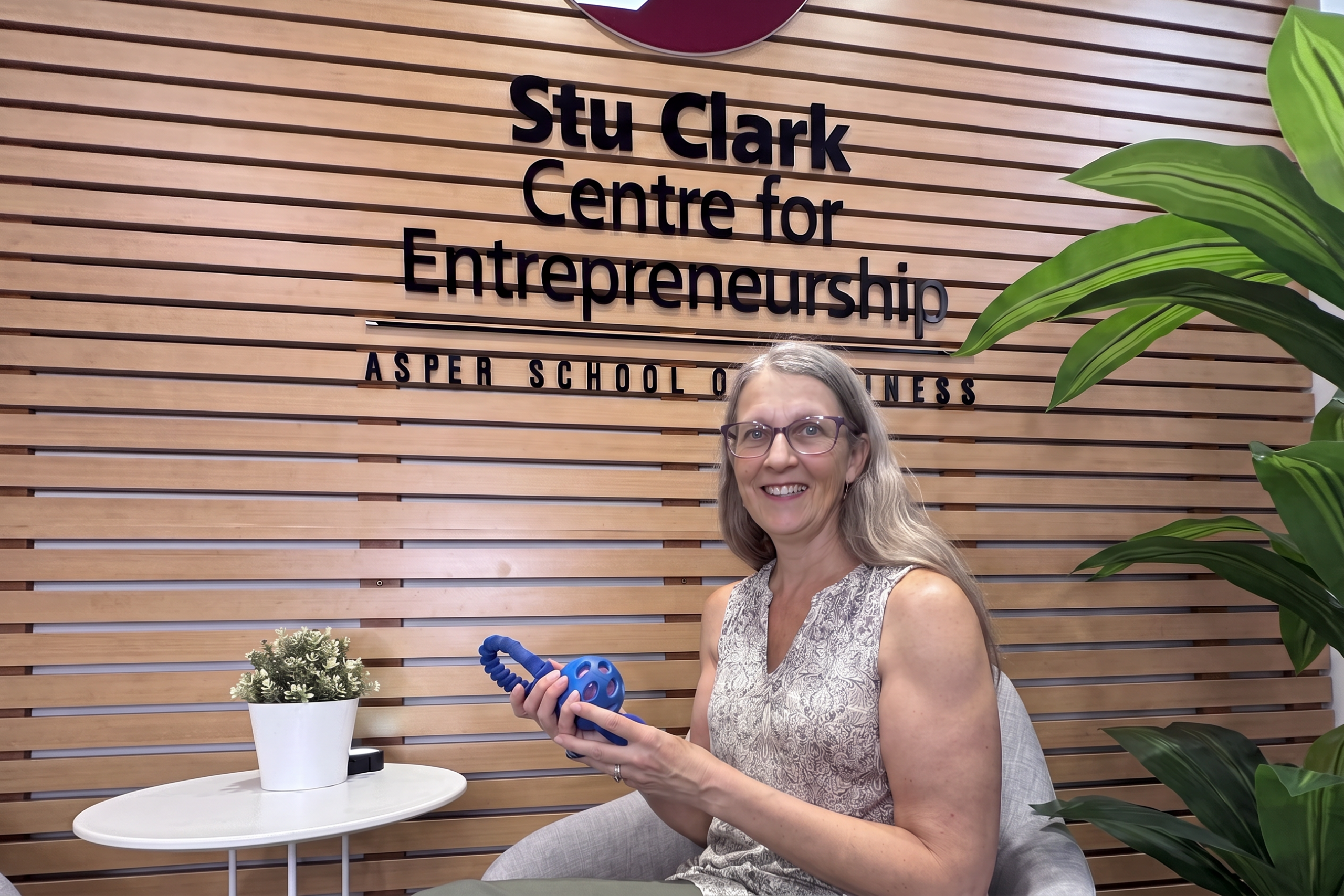Selena Randall at the Stu Clark Centre for Entrepreneurship, showcasing one of the interactive tools she uses in her online dog behavior consulting.
