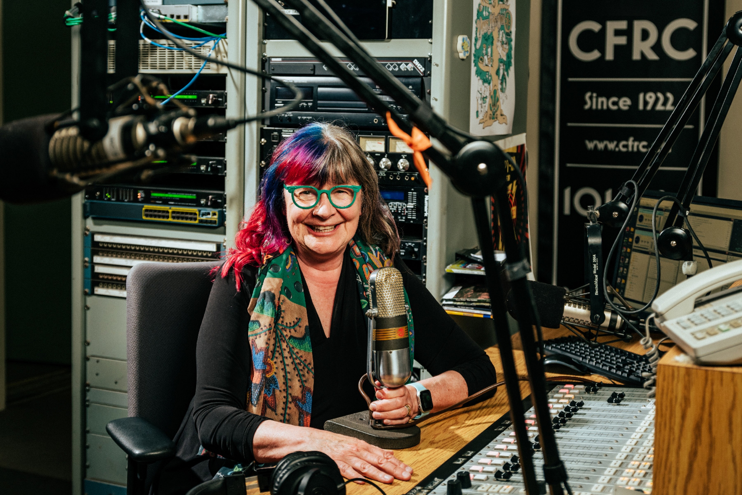 Shelagh Rogers in a booth with microphones