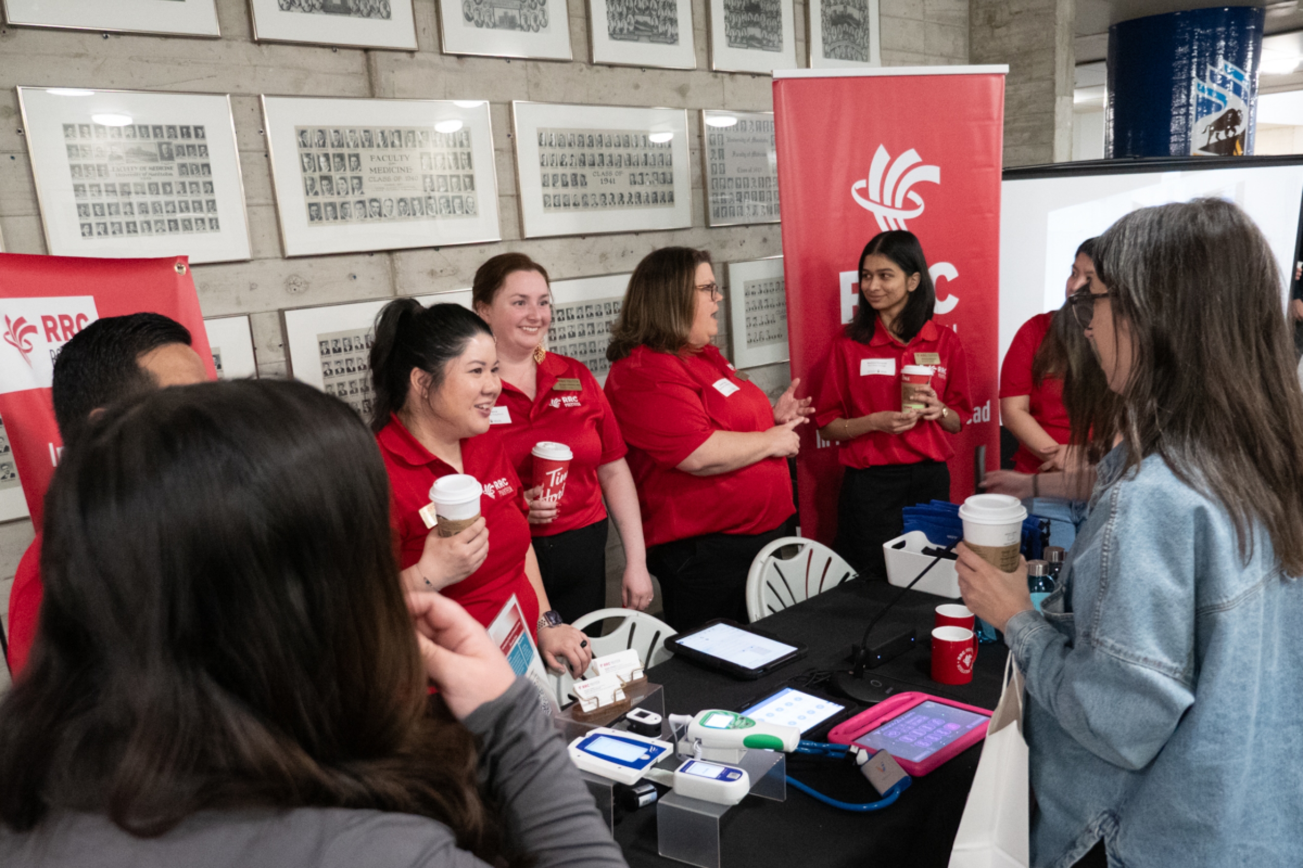 RRC Polytech team booth with event participants talking to them.