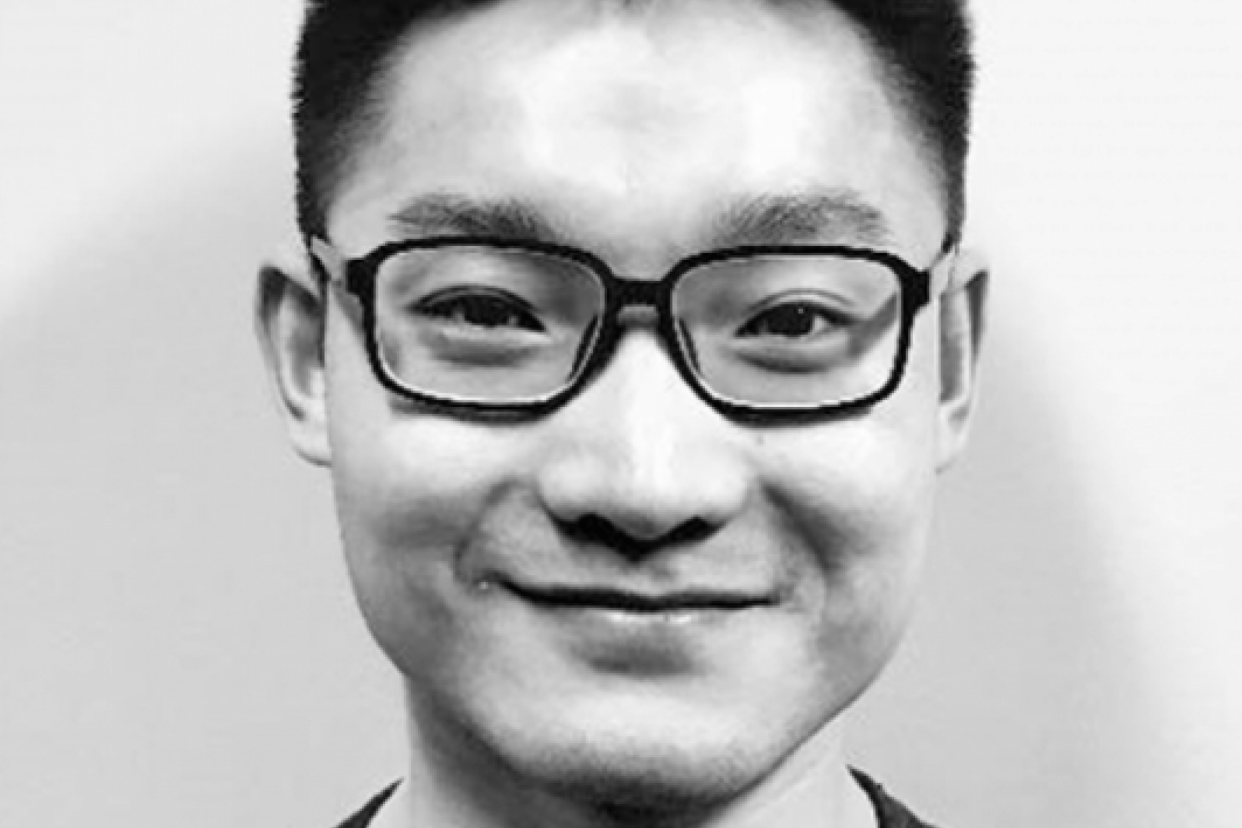 a smiling man with glasses