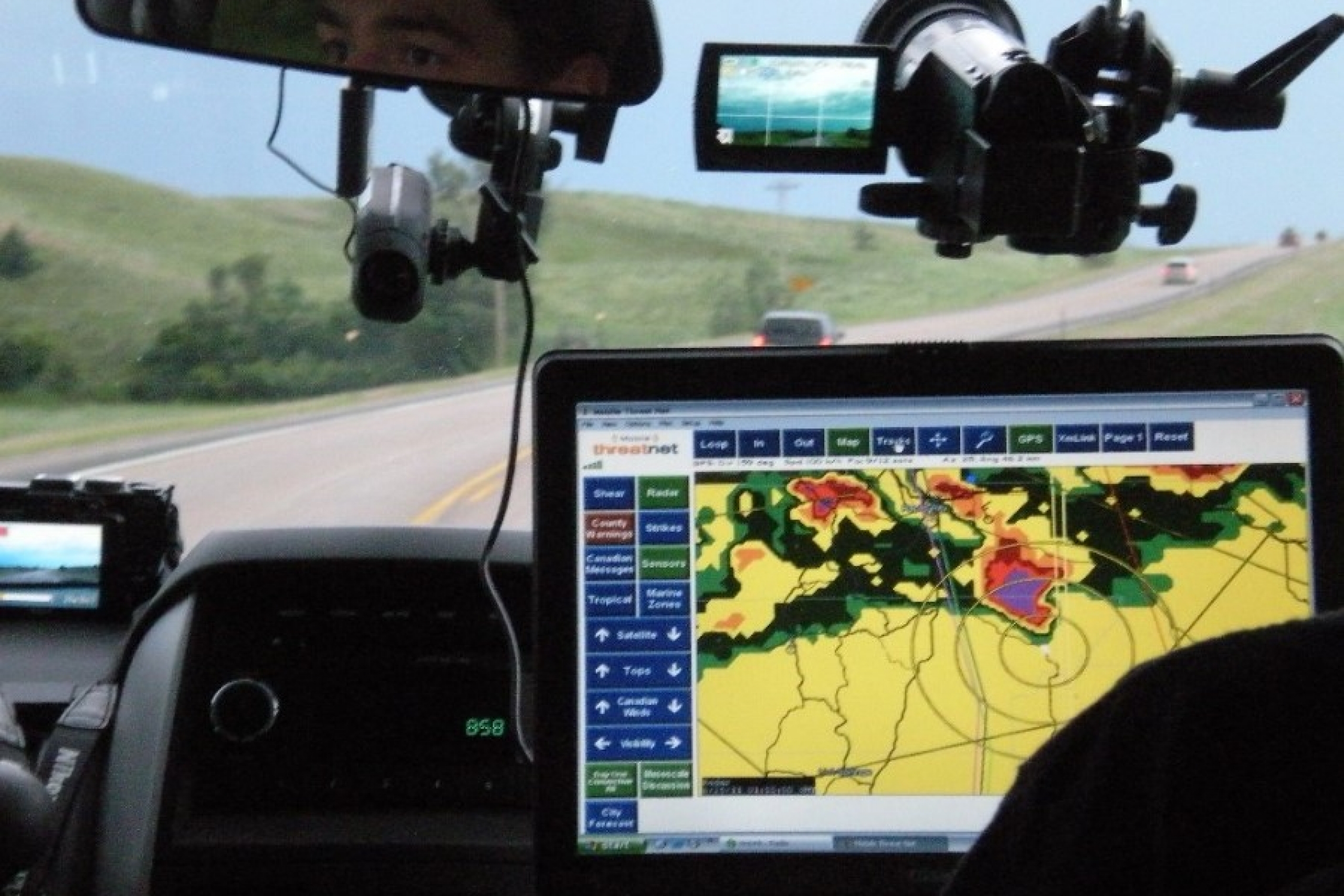 A digital map displays various information on weather tracking.