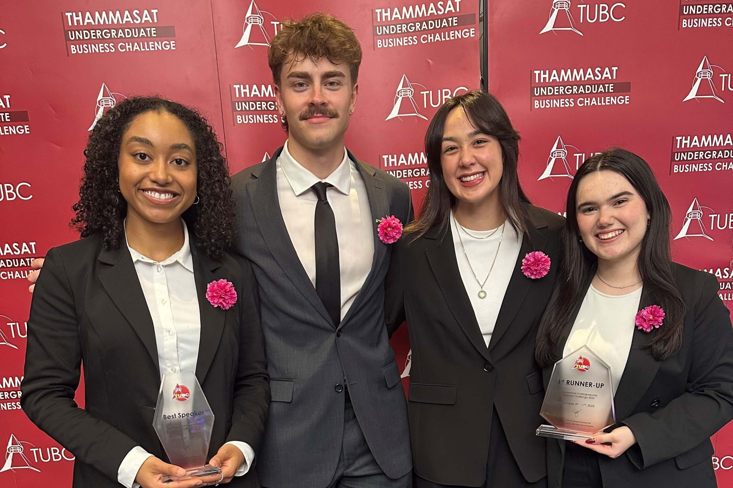 The four Asper BComm students posing with their trophies.