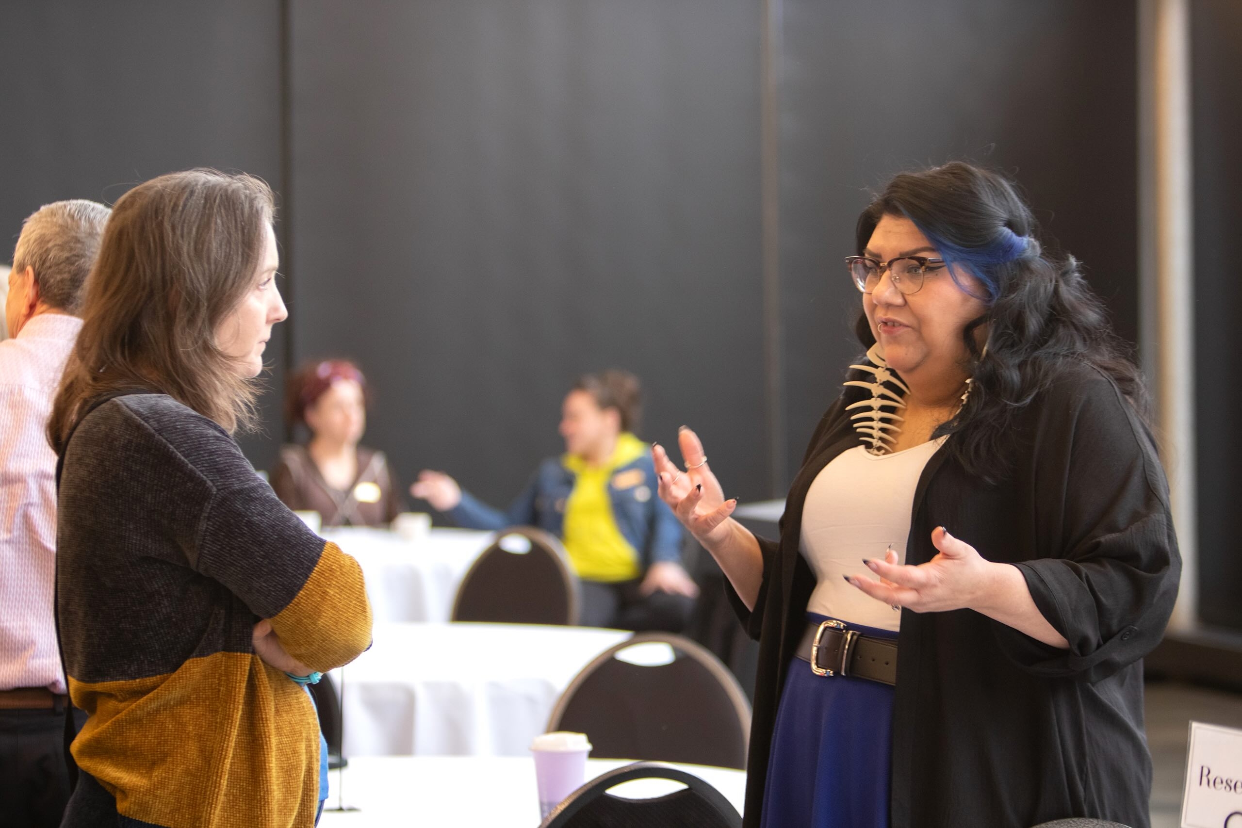  Indigenous futurist and researcher Keeta Gladue speaks with symposium participant after the panel.
