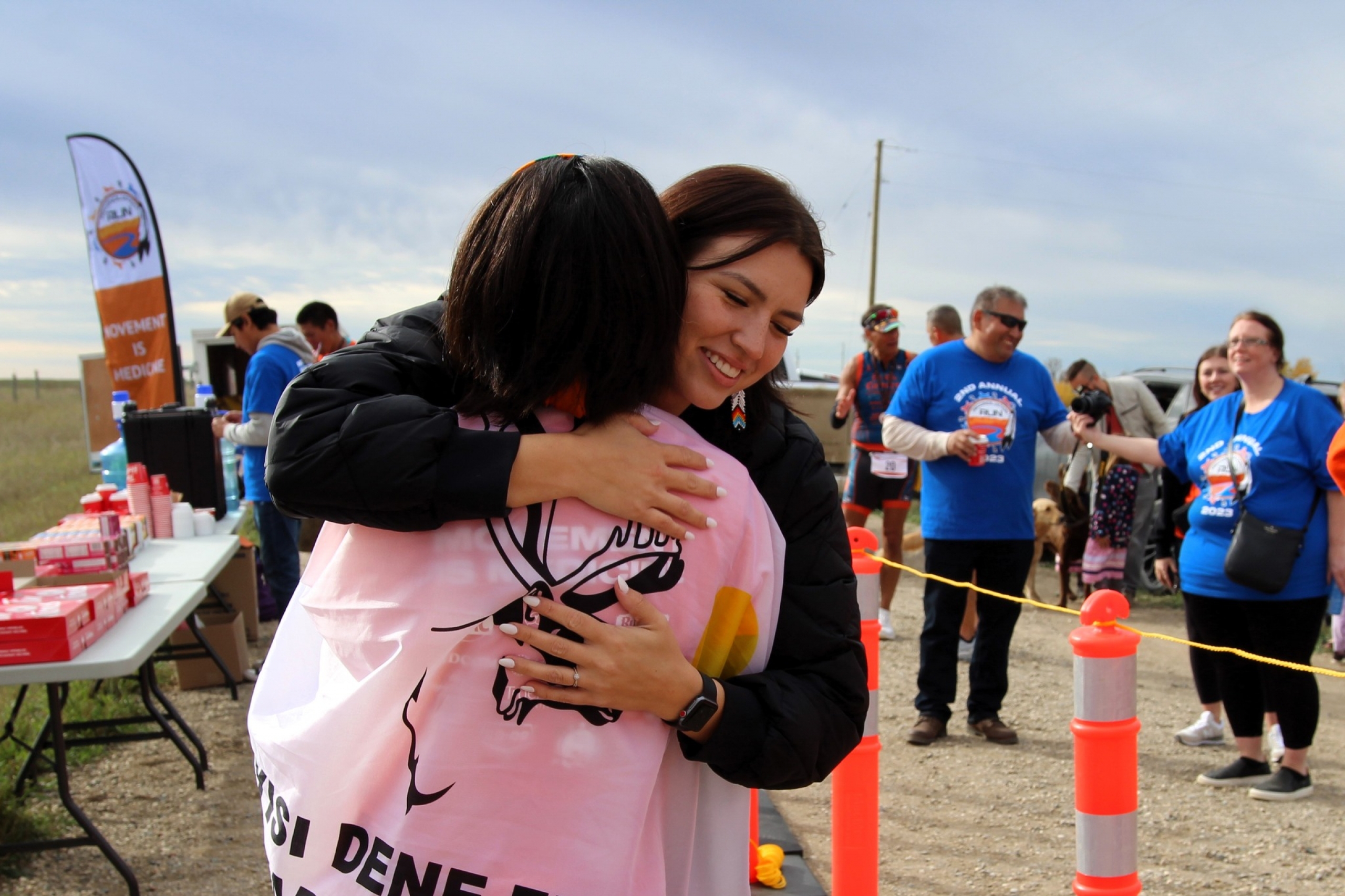Tréchelle Bunn hugging a participant at the Reconciliation Run finish line