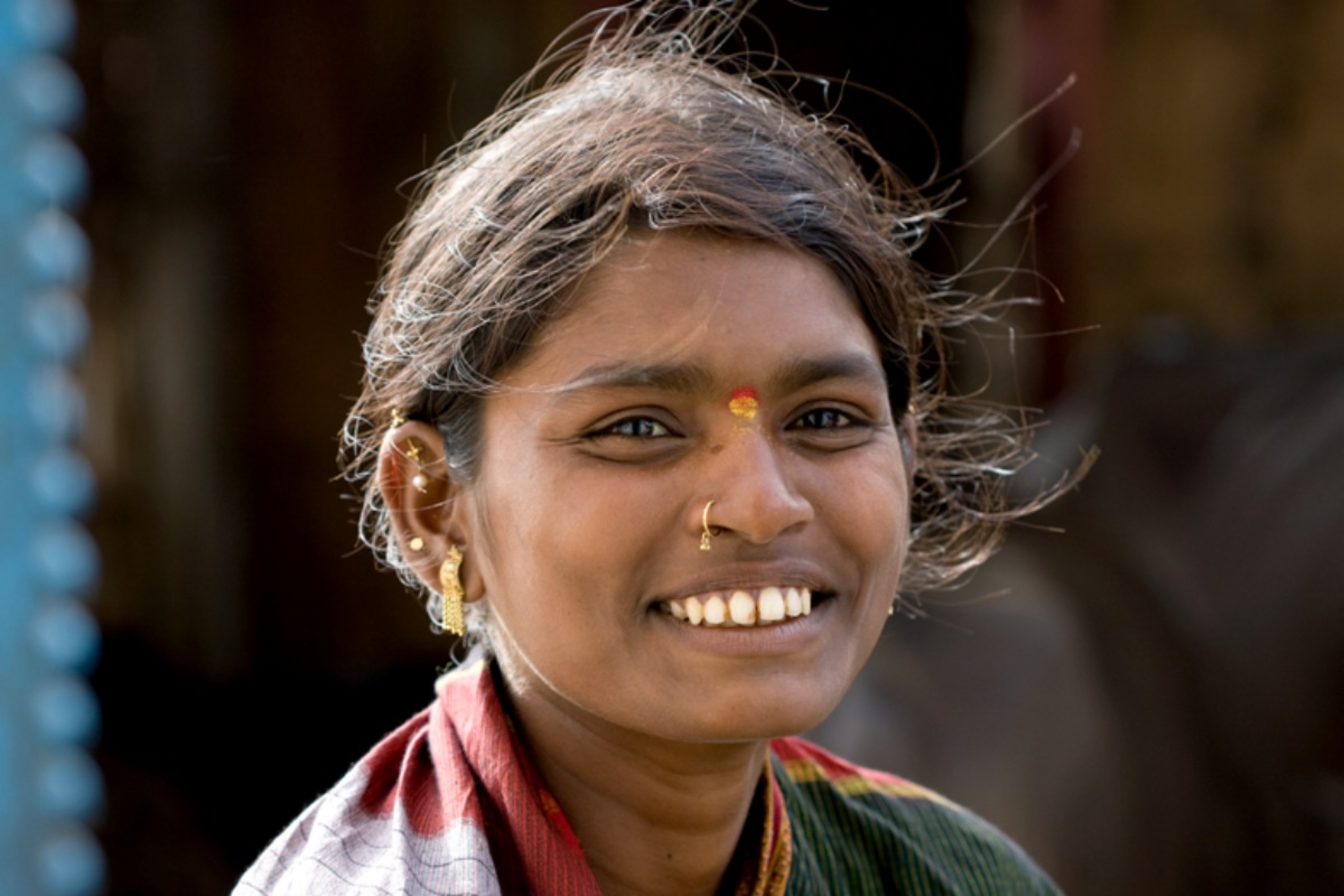 A close up of a young girl smiling at the camera.