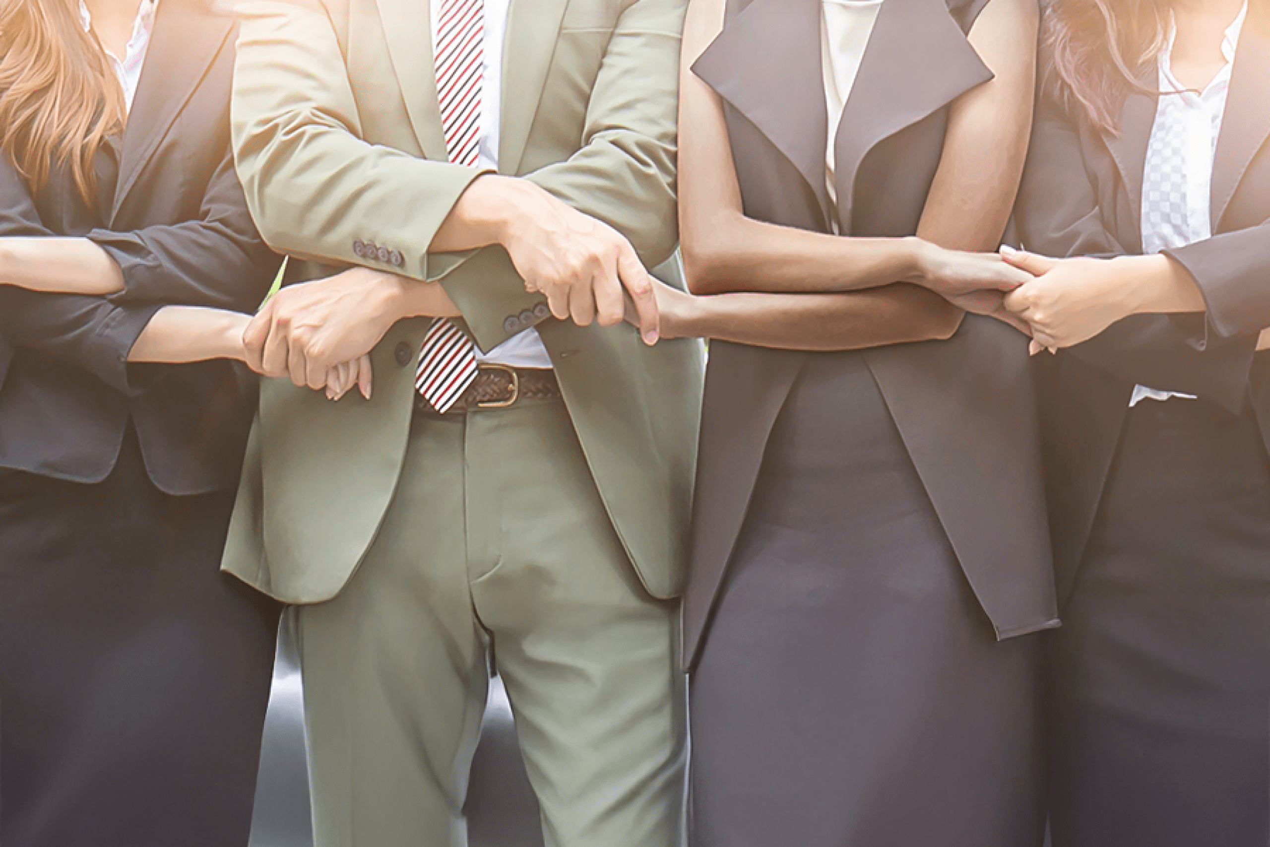 Business people join hands in partnership