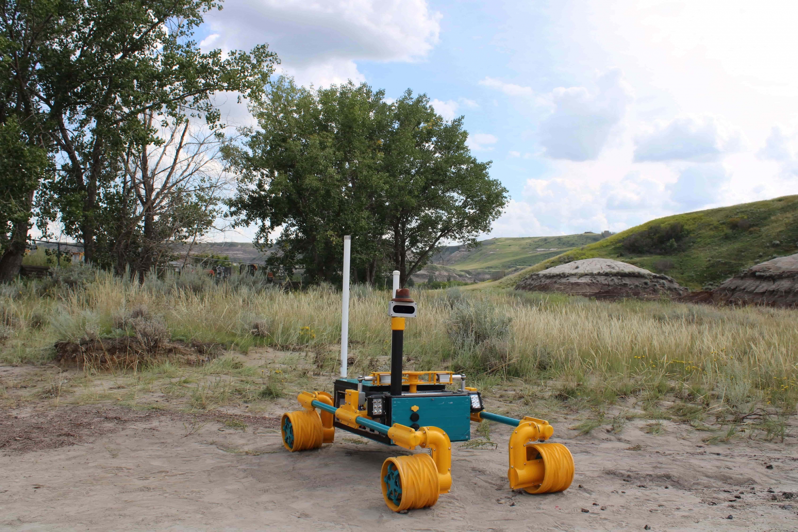 A rover outside in a hilly terrain