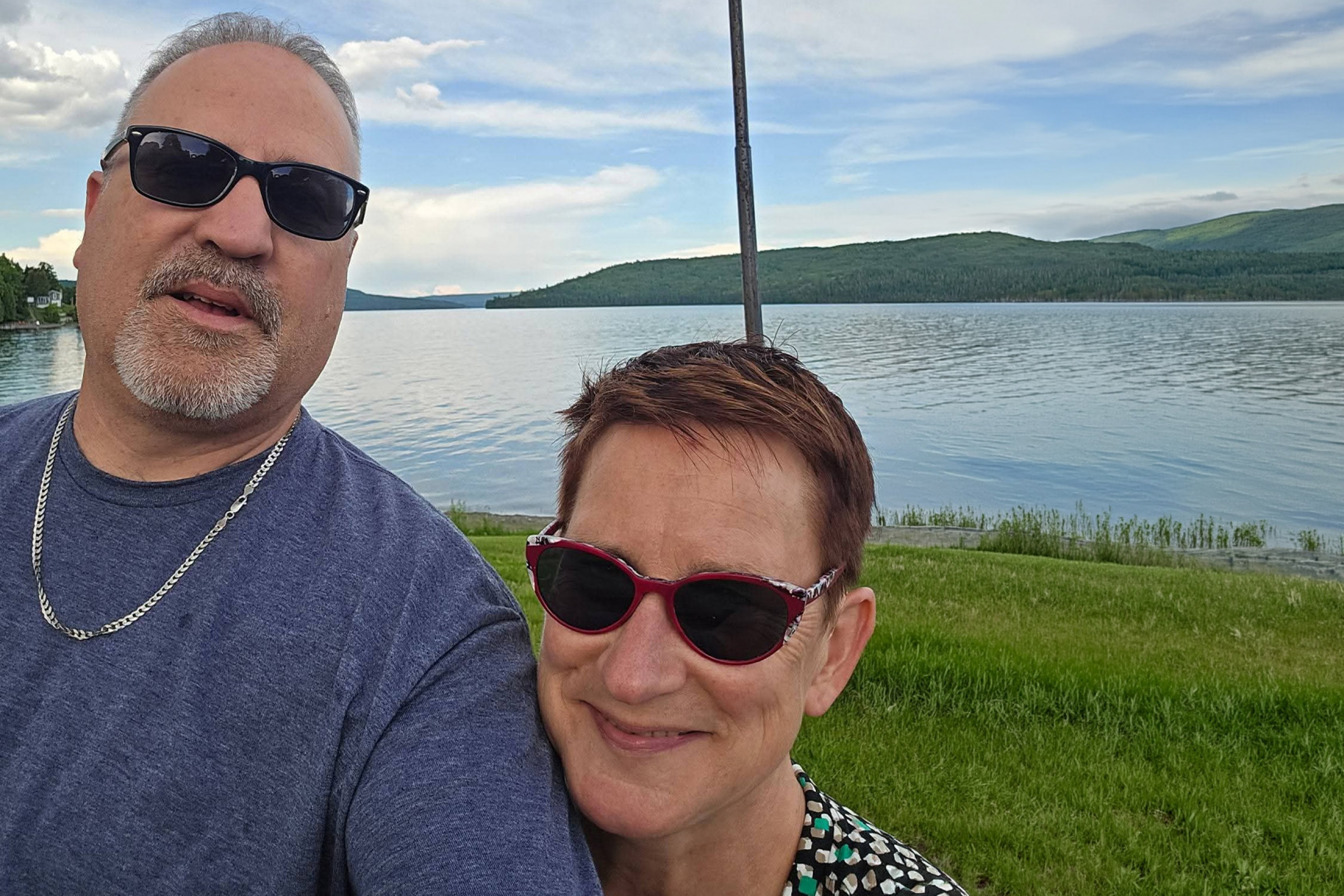 Laurene Rehman with her partner ken in front of a body of water