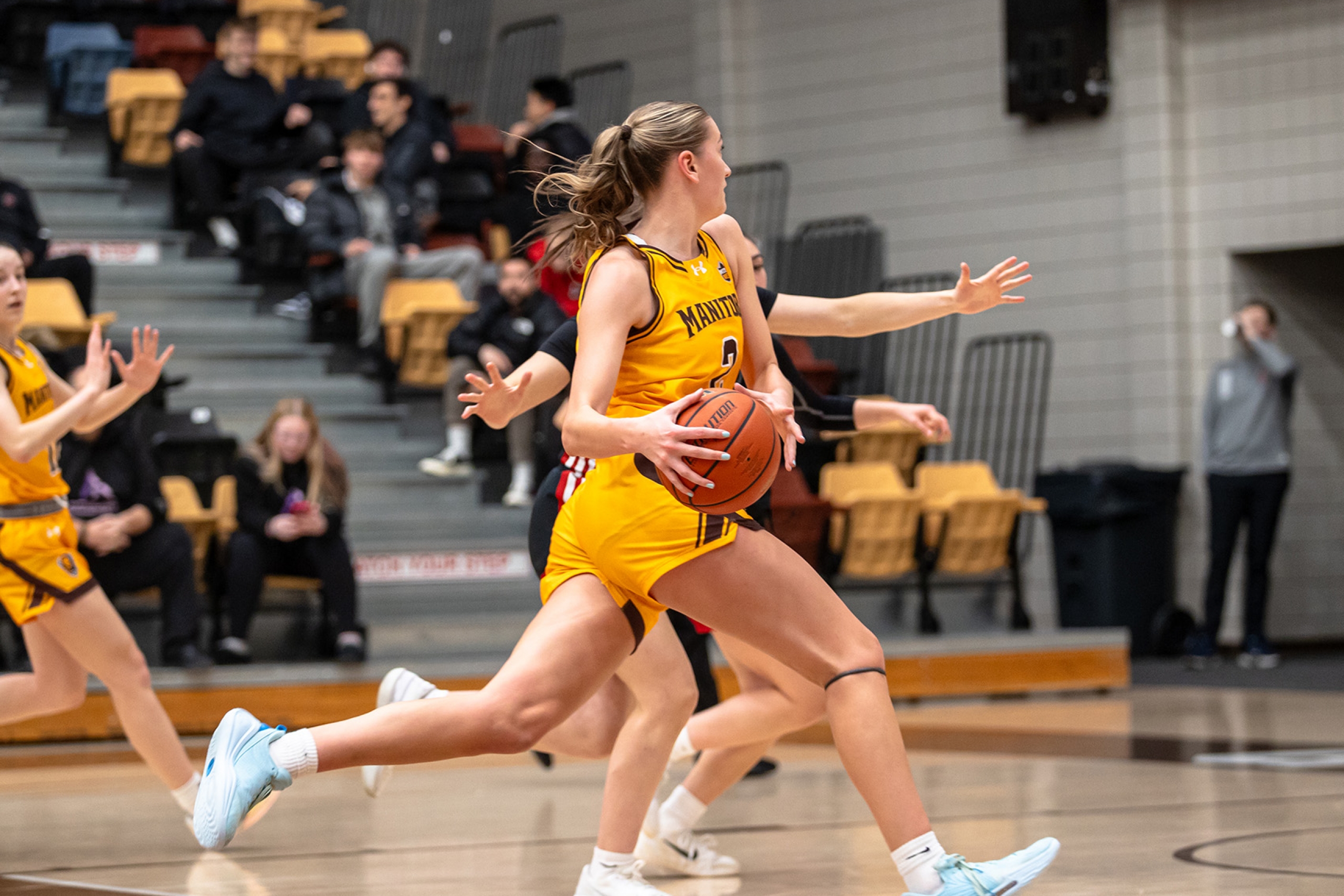 Anna Miko makes a play during a Bisons women's basketball game against cross town rivals the Winnipeg Wesman.