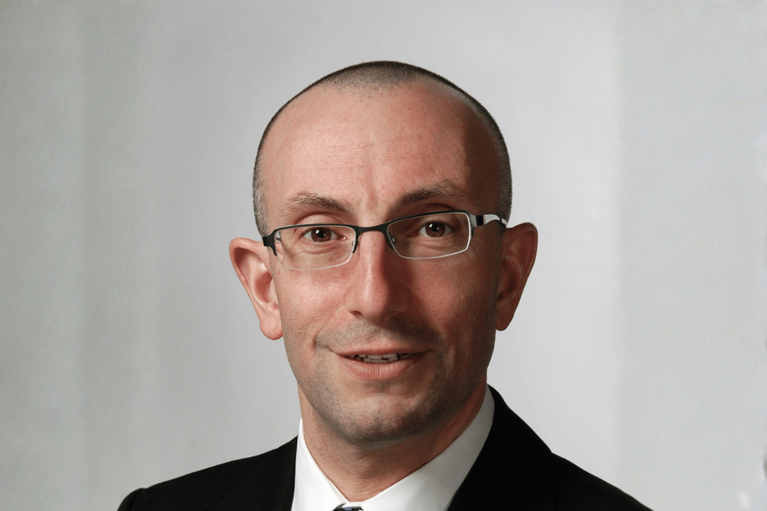 a headshot of Dr. John Embil