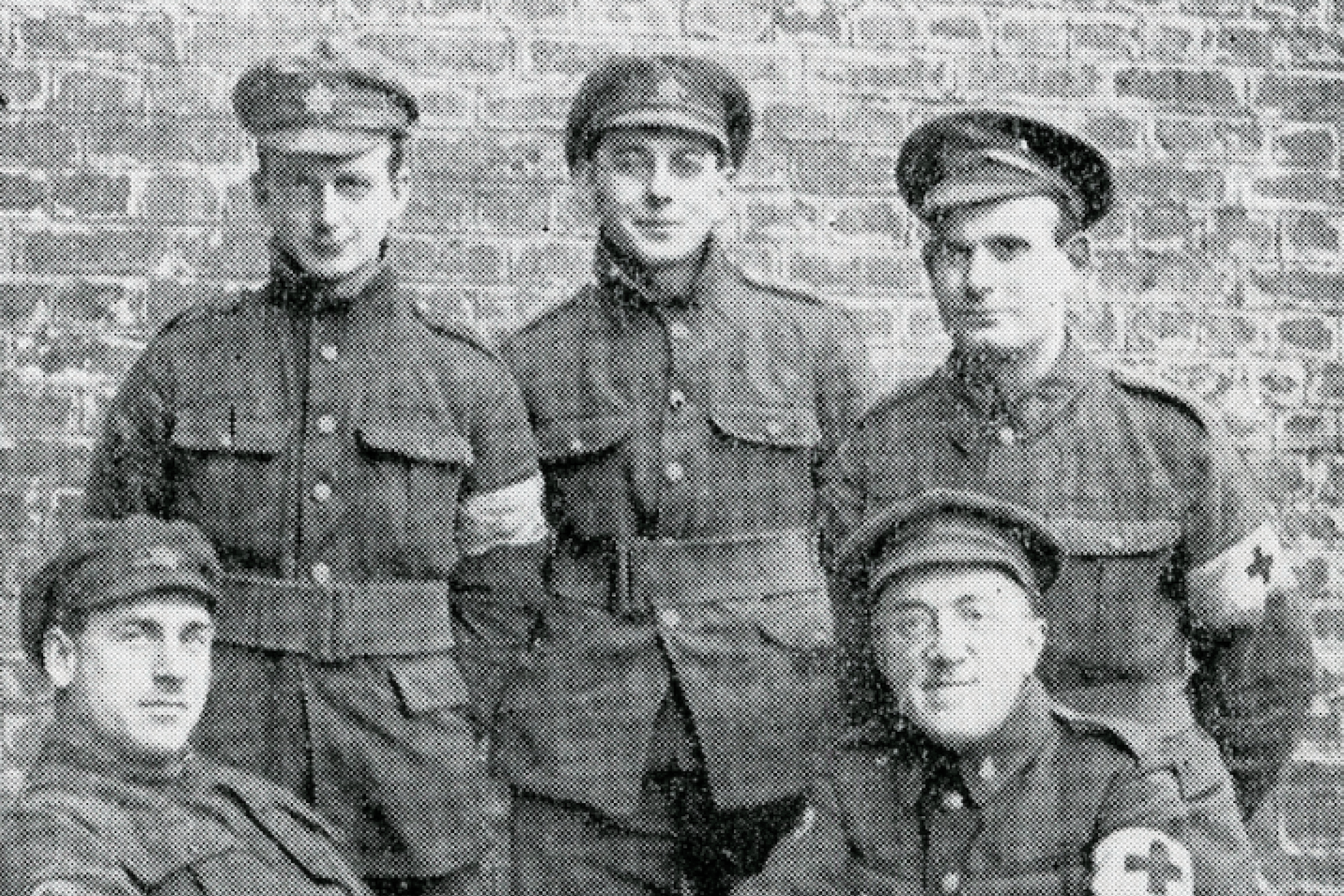 Archive photo from World War one showing five men wearing army uniforms.