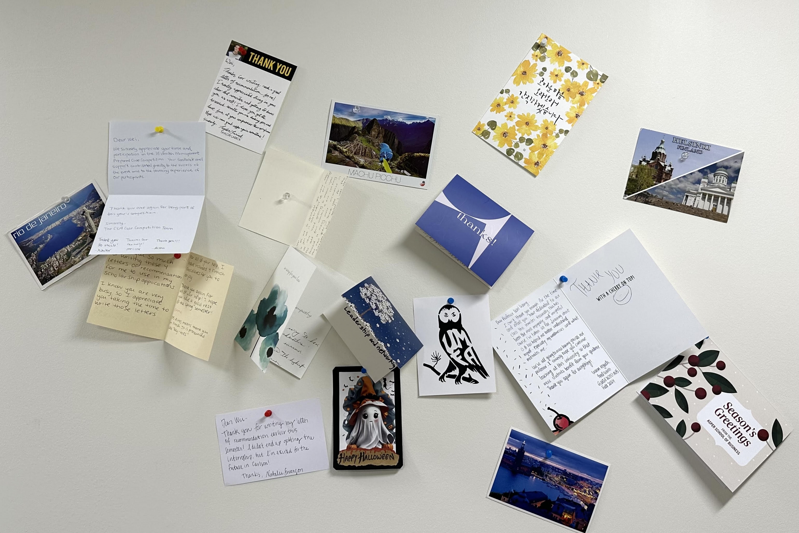 A wall of thank you notes pasted against a wall