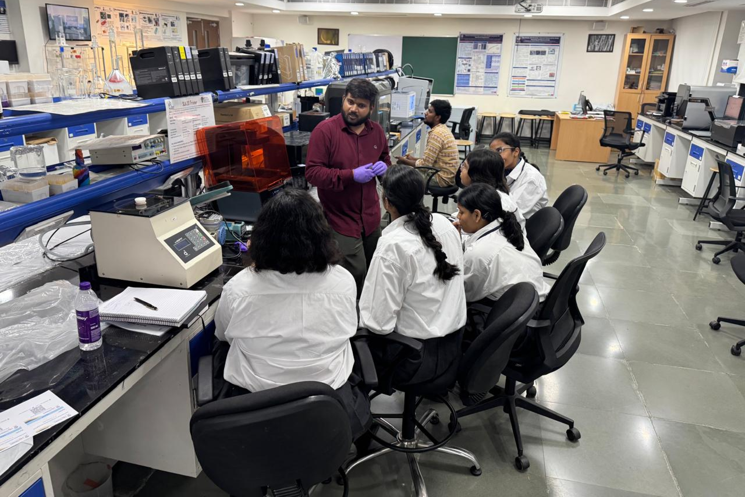 A team siting in the lab.