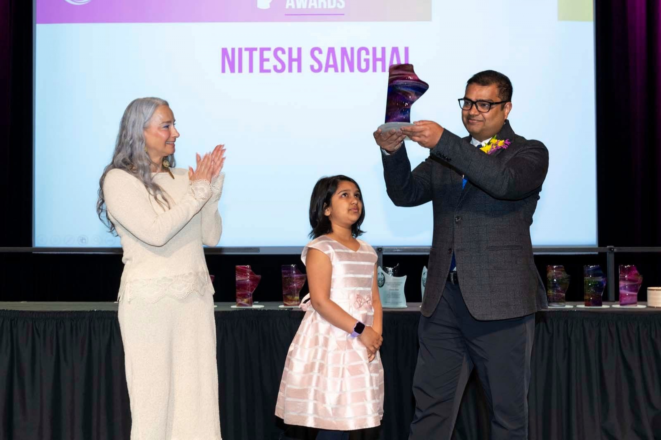 (left to right) Minister Nahanni Fontaine, Dr. Nitesh Sanghai's daughter and Dr. Nitash Sanghai
