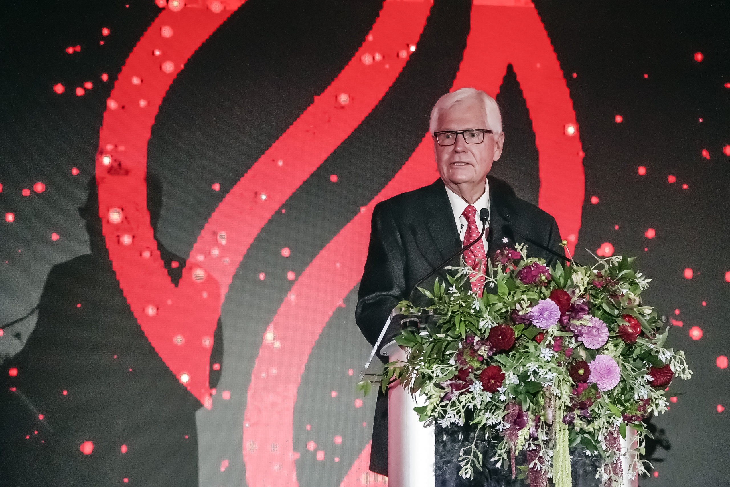 Arni Thorsteinson at a podium