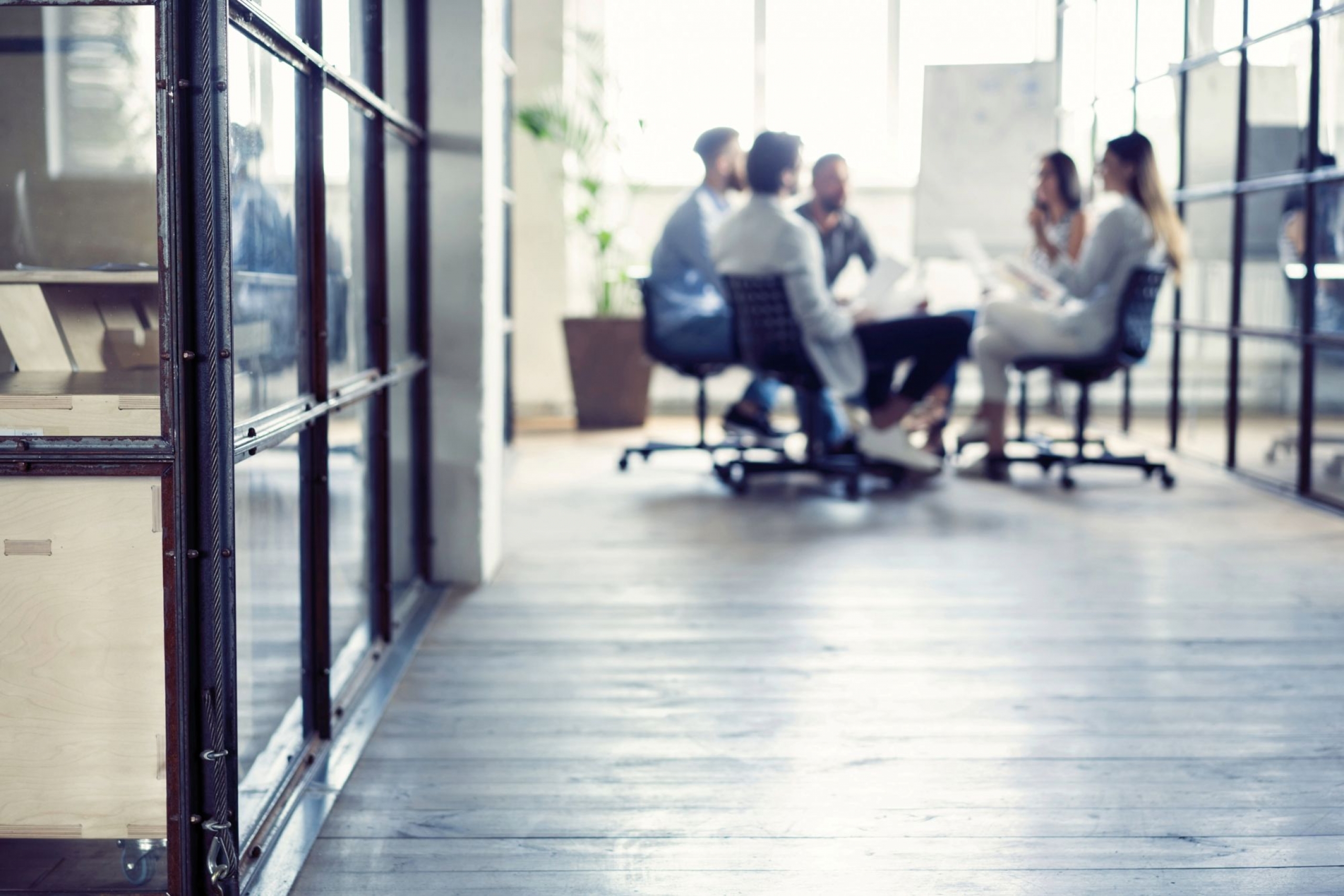 group gathered around a meeting table.
